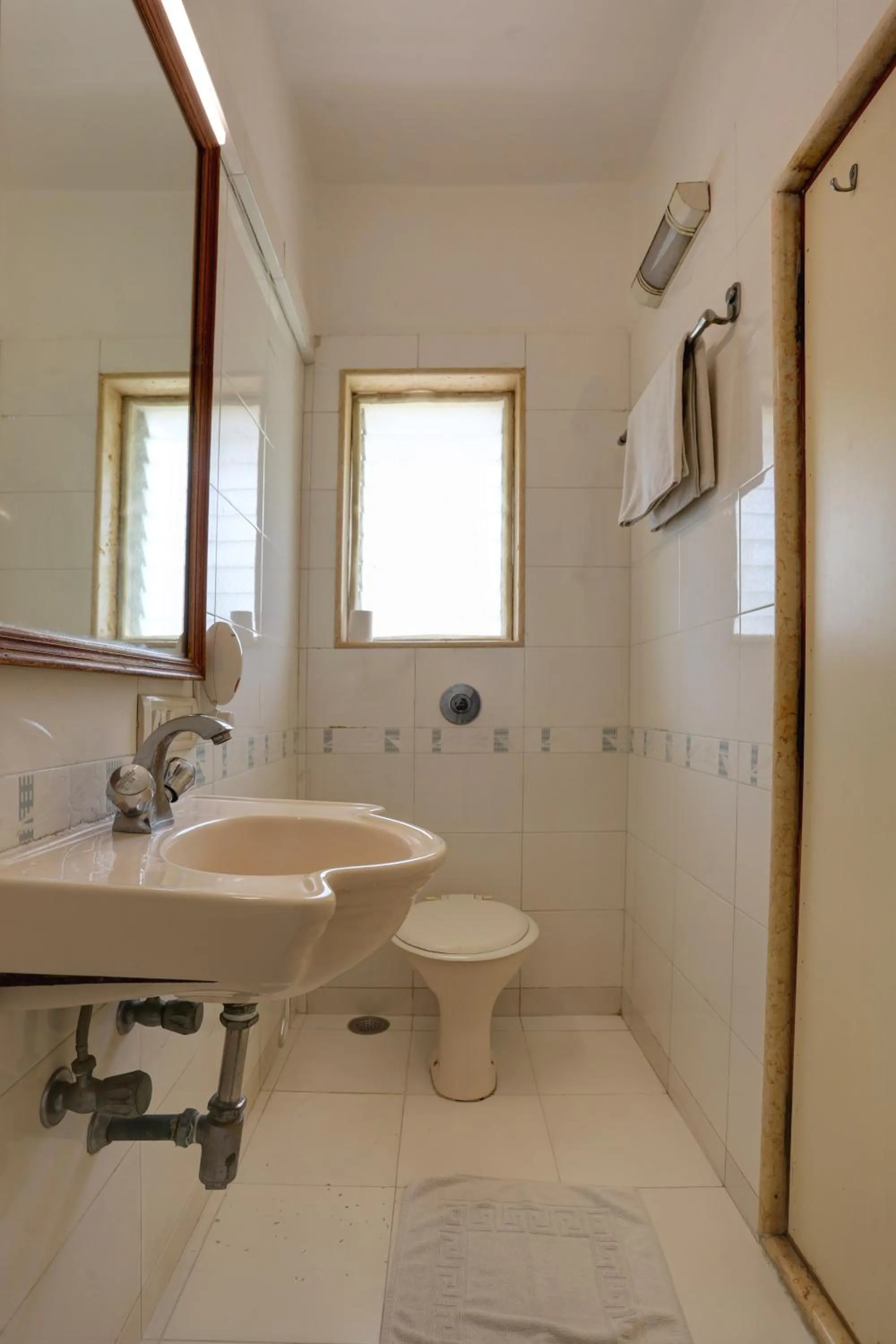 Toilet in Accord Hotel