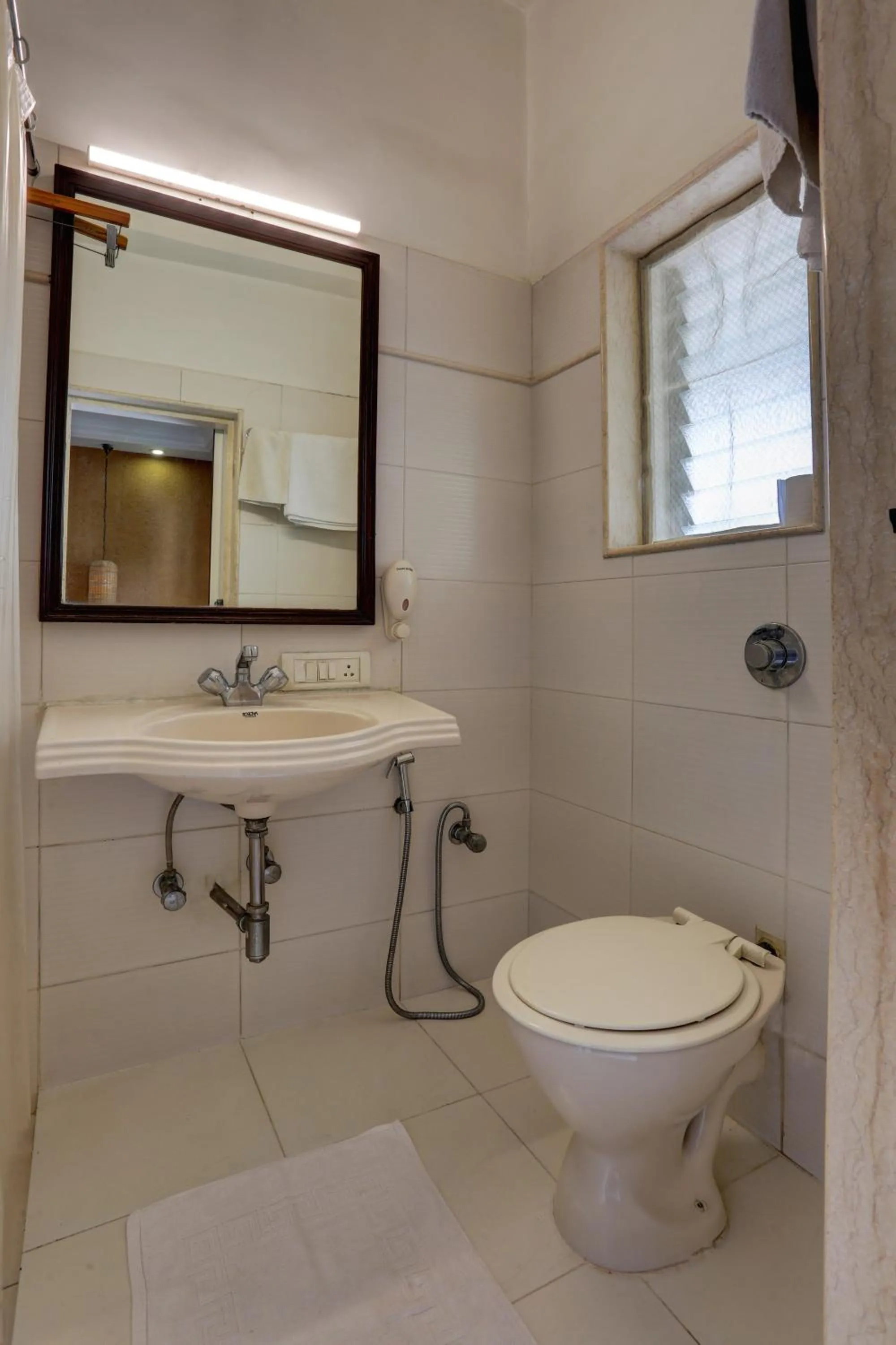 Toilet in Accord Hotel