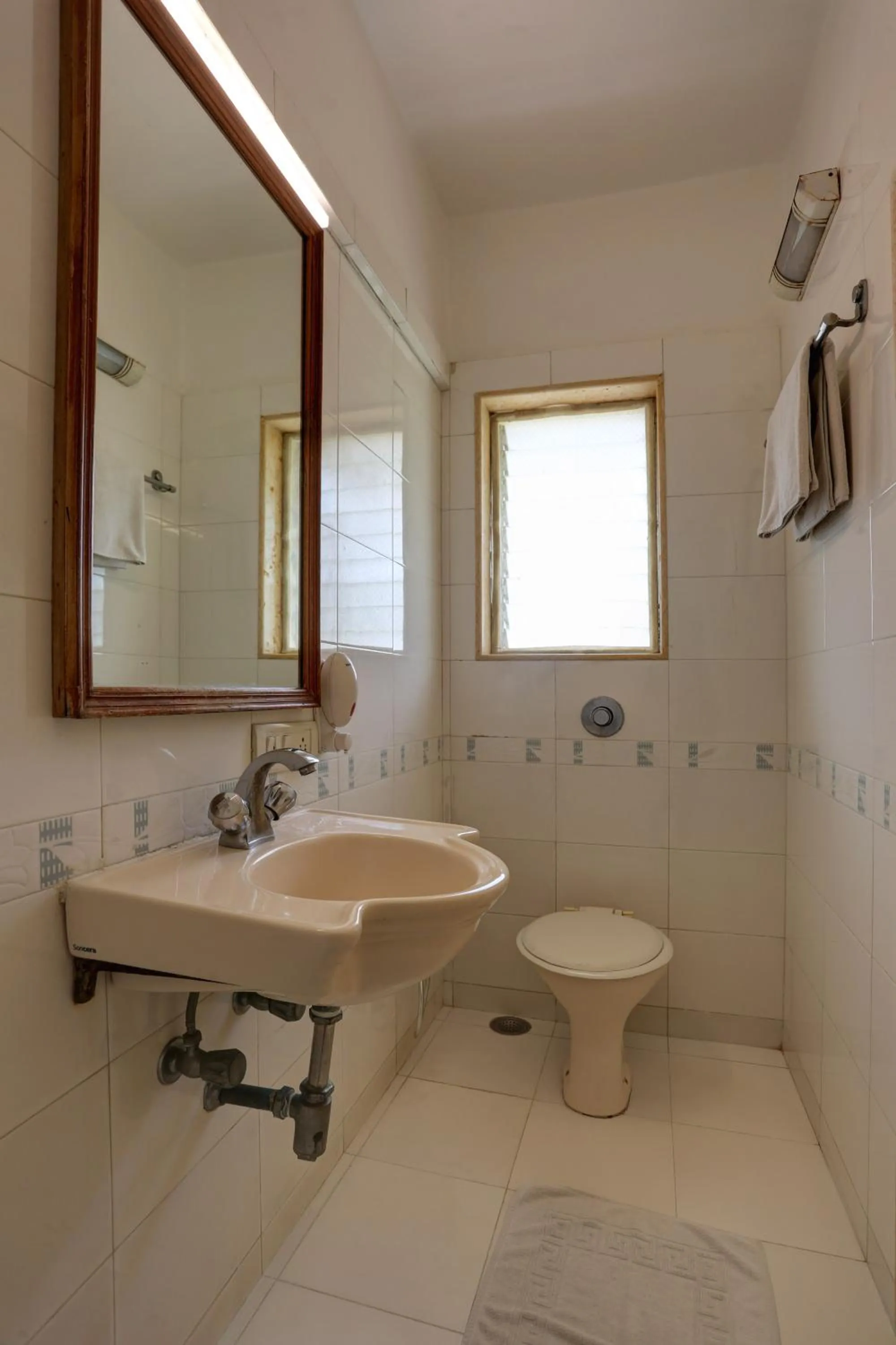 Toilet in Accord Hotel