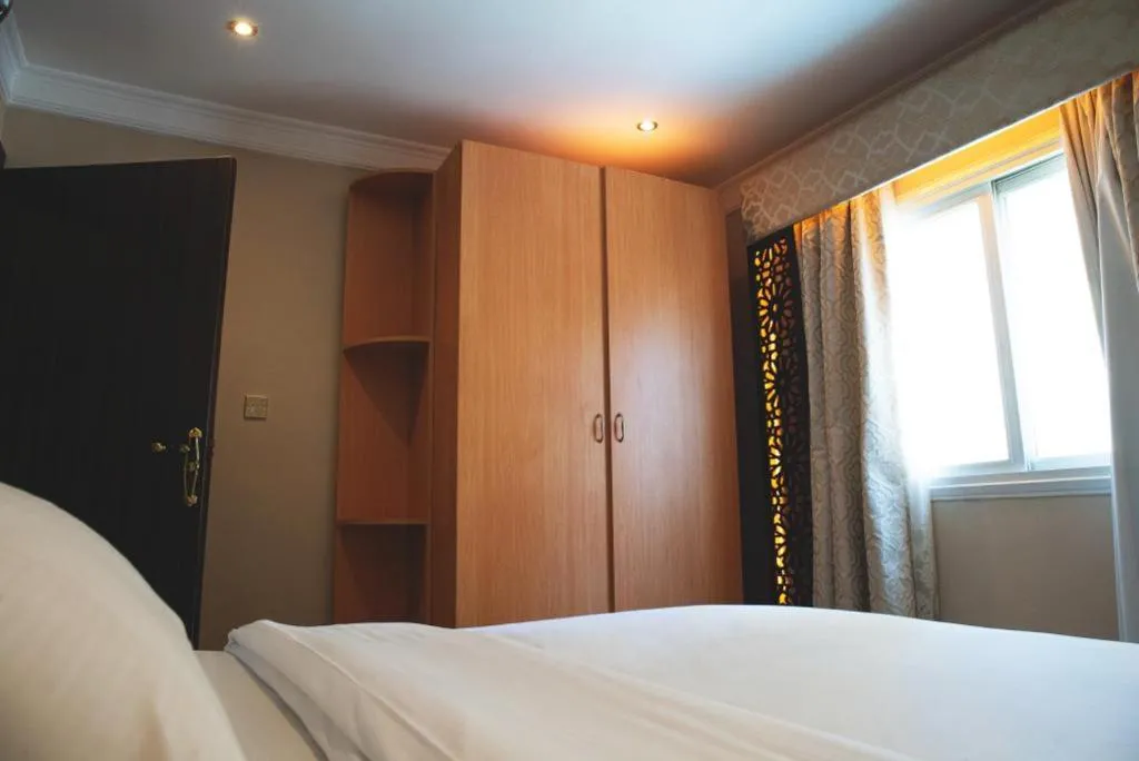 wardrobe, Bed in Terrace Furnished Apartments- Fintas1