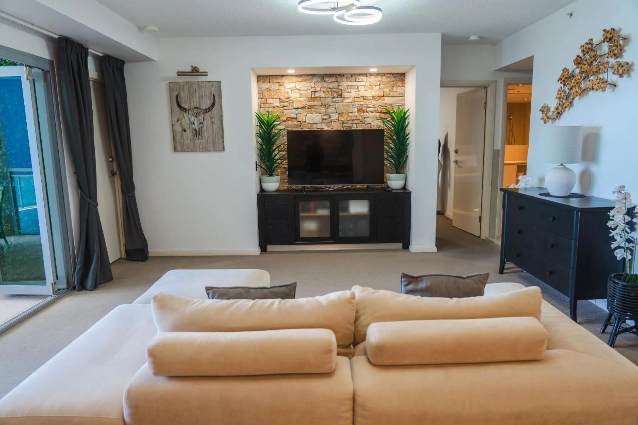 Living room, Bed in Proximity Waterfront Apartments