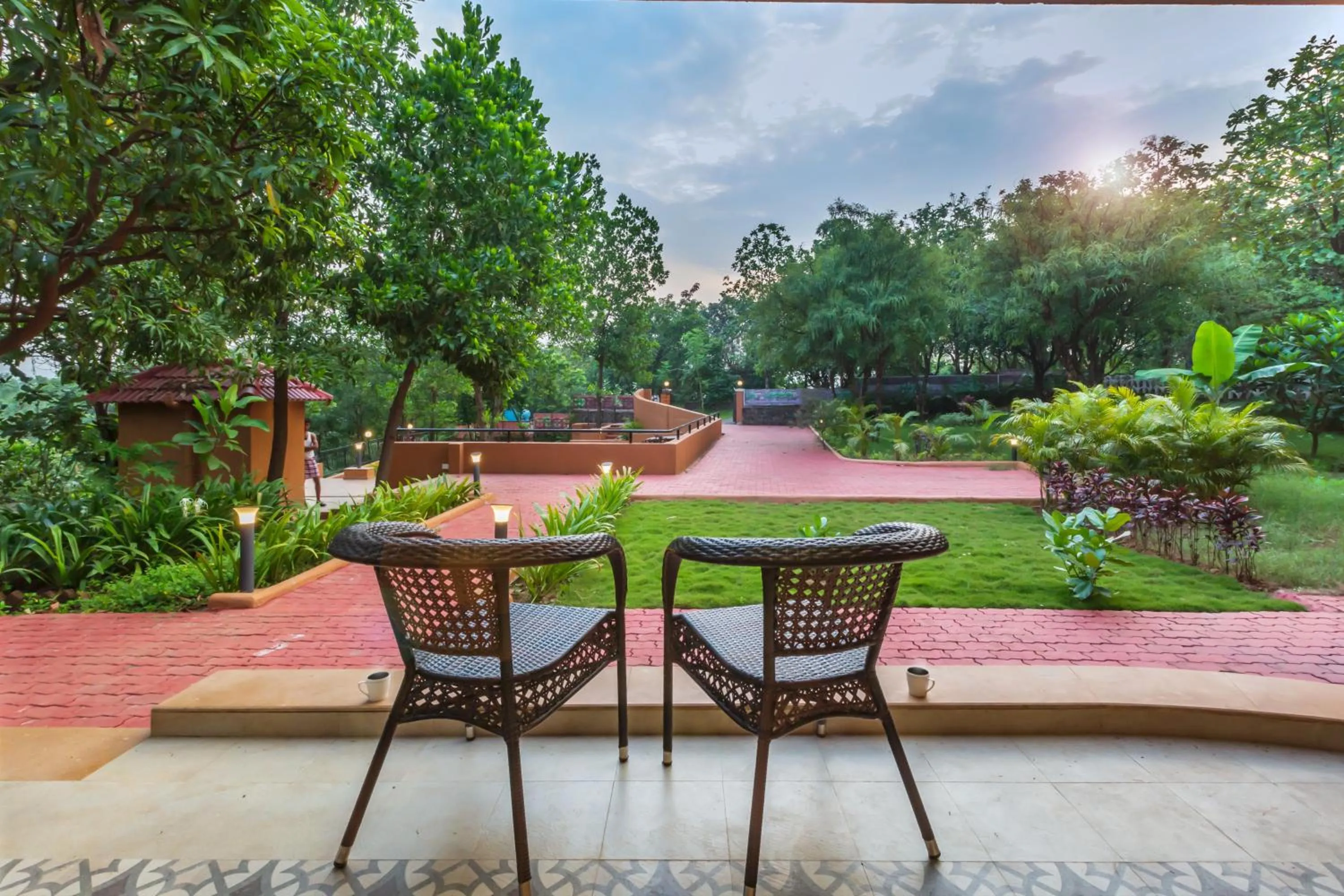 Day in SaffronStays Ekaant- 3BR pet-friendly pool villa with lawn, games & river walk in gated community near Mumbai