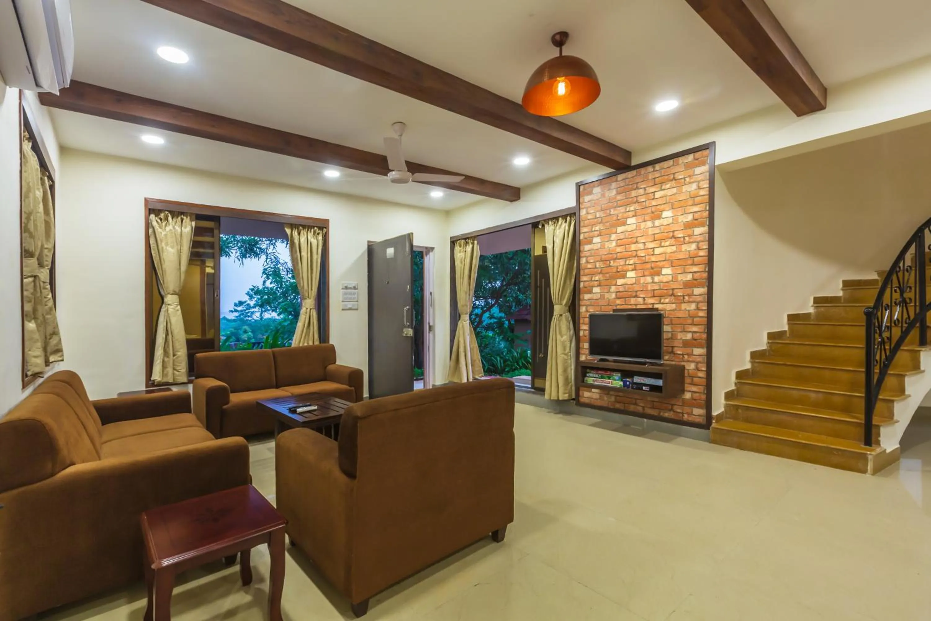 Day in SaffronStays Ekaant- 3BR pet-friendly pool villa with lawn, games & river walk in gated community near Mumbai