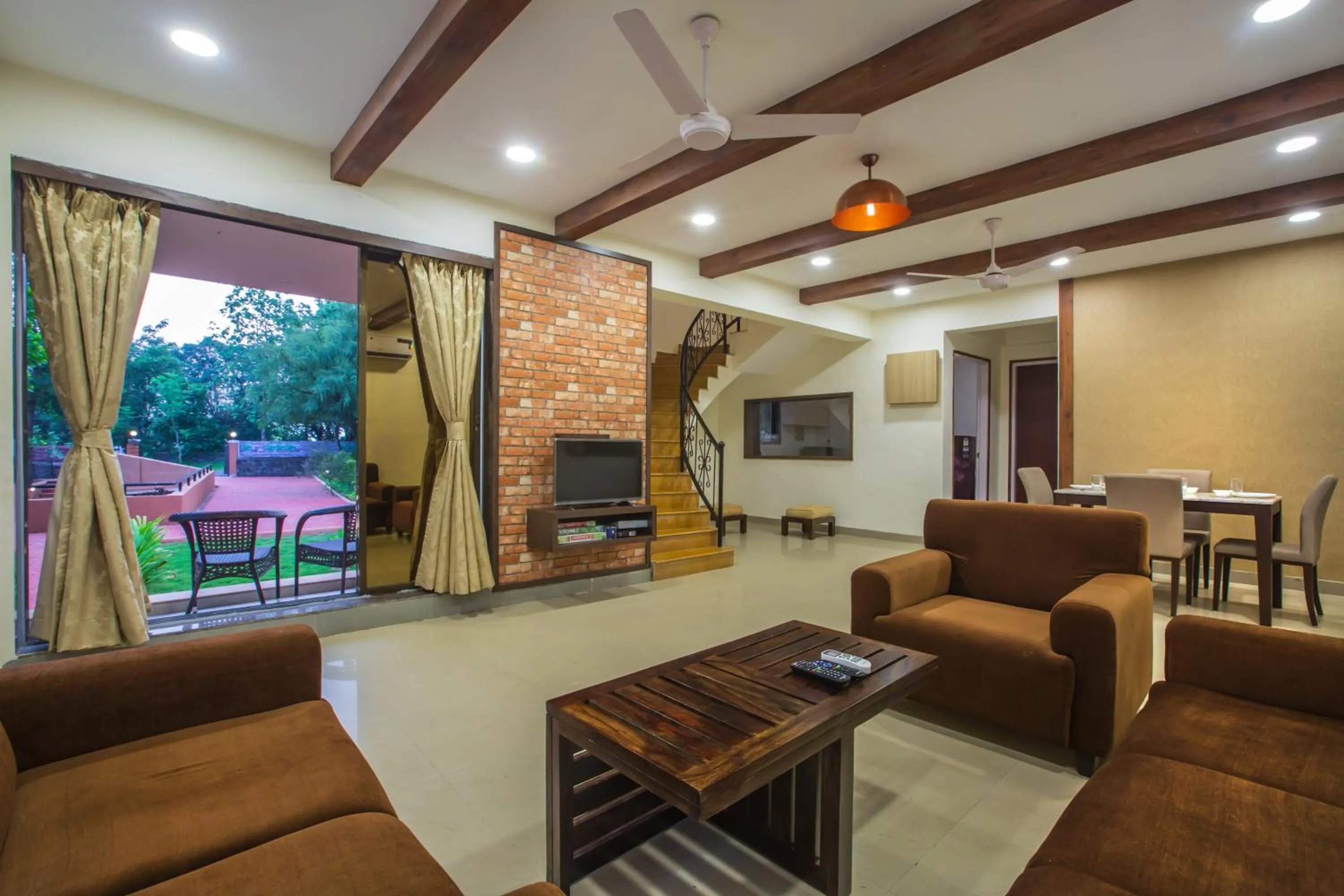 Communal lounge/ TV room in SaffronStays Ekaant- 3BR pet-friendly pool villa with lawn, games & river walk in gated community near Mumbai
