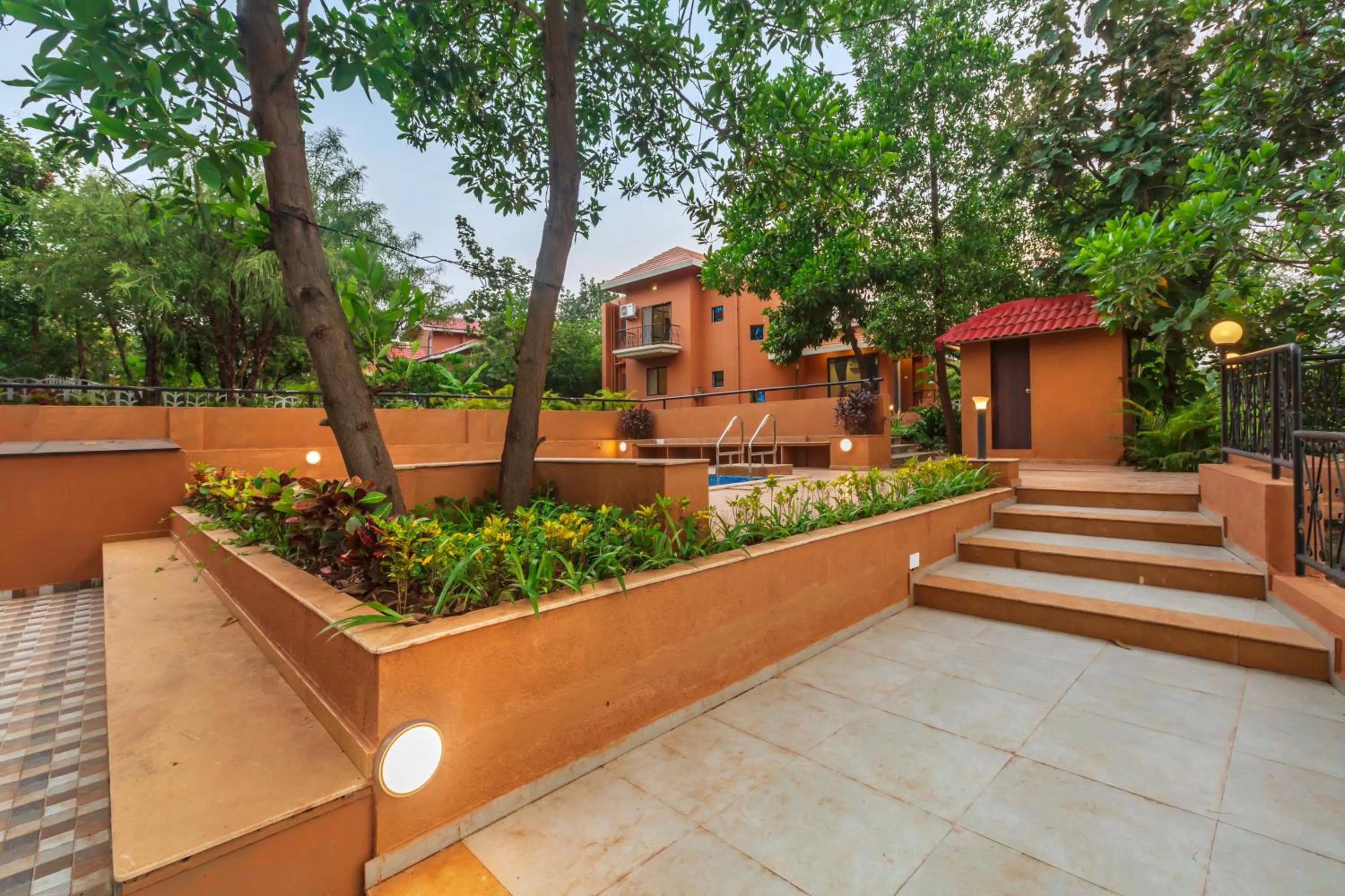 Property building in SaffronStays Ekaant- 3BR pet-friendly pool villa with lawn, games & river walk in gated community near Mumbai