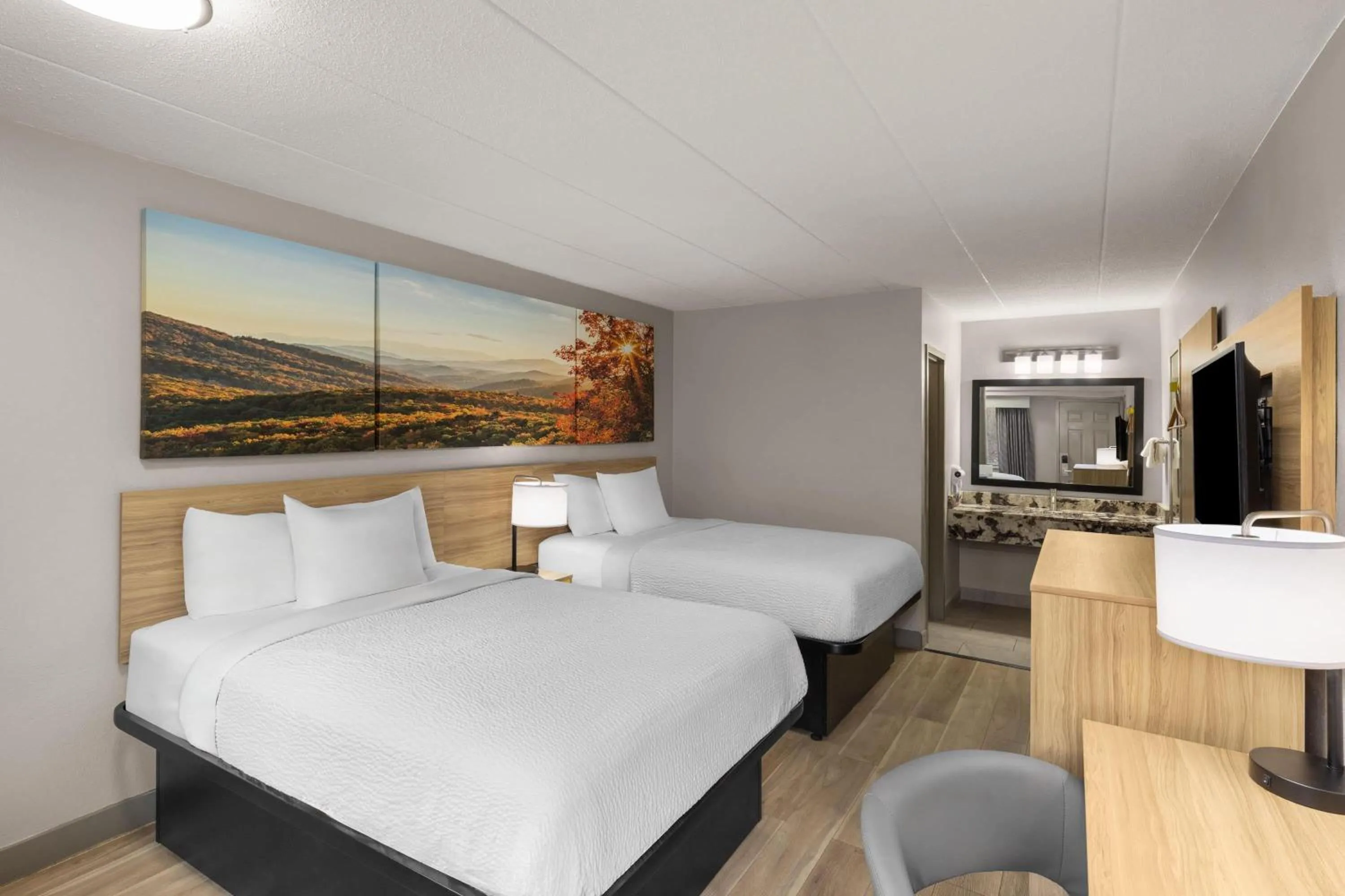 Photo of the whole room, Bed in Days Inn by Wyndham Charleston WV