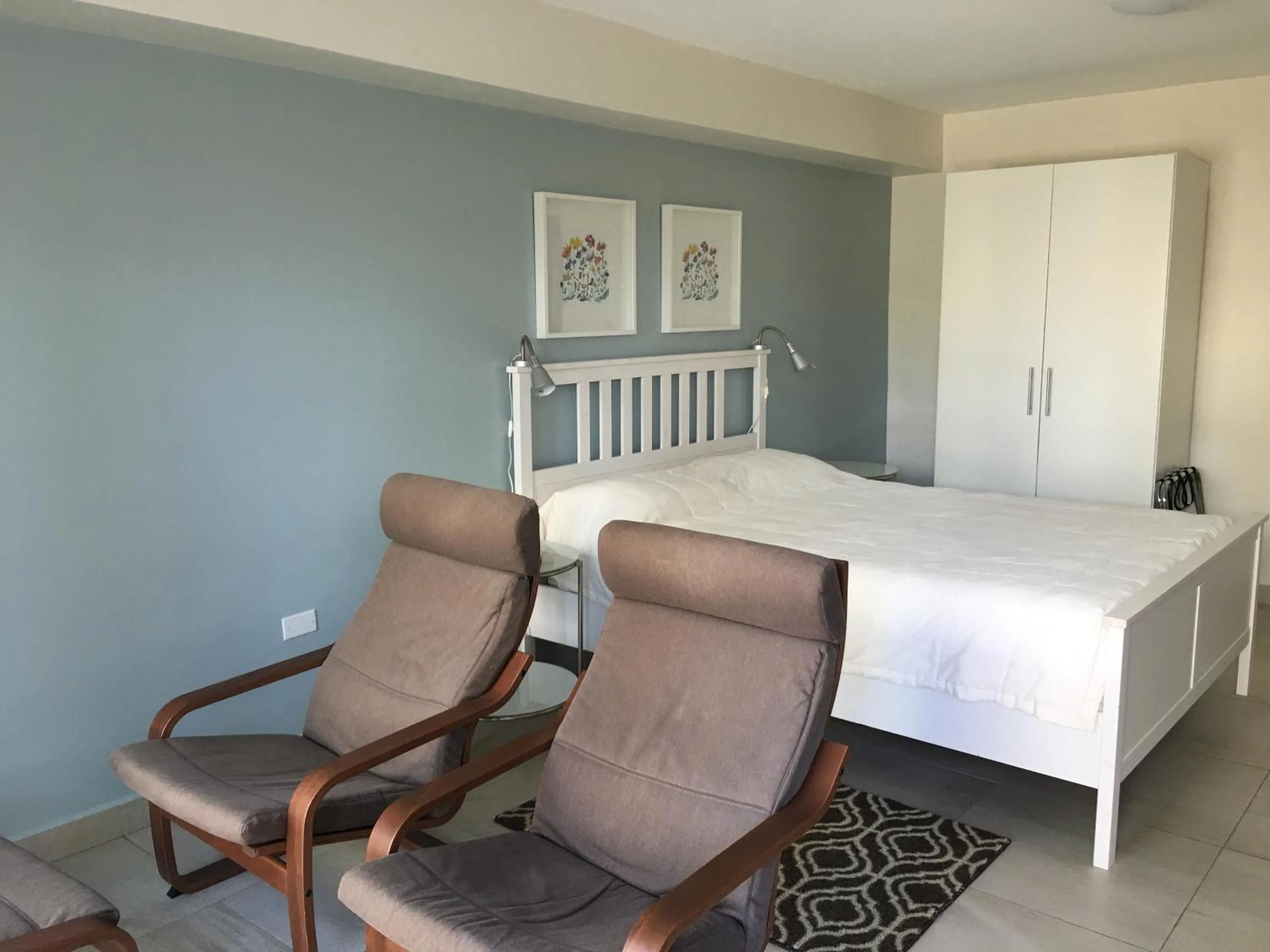 Photo of the whole room, Bed in Dali Suites -Accommodations in Playas de Tijuana