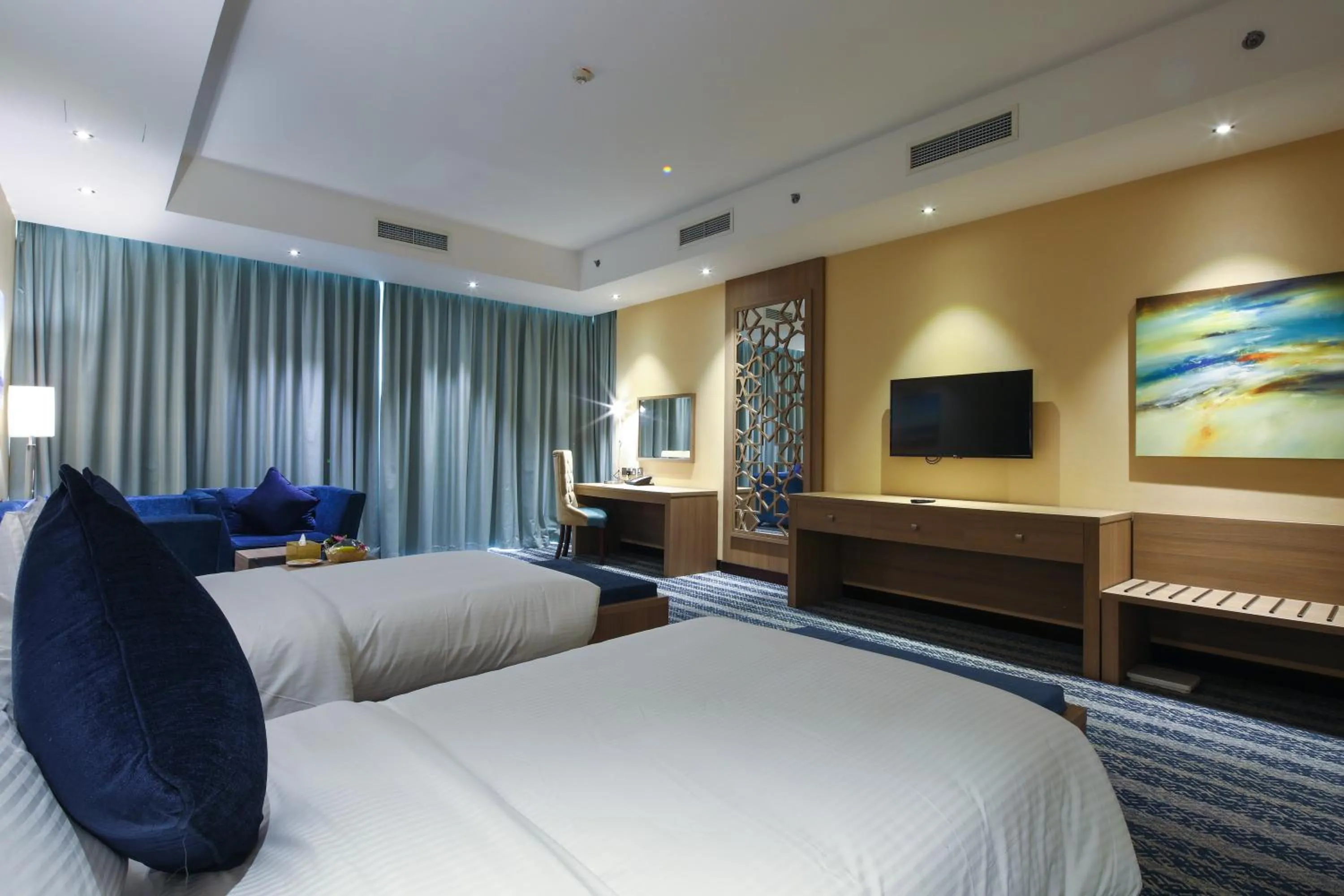 Bed in The CASTLE PREMIUM HOTEL