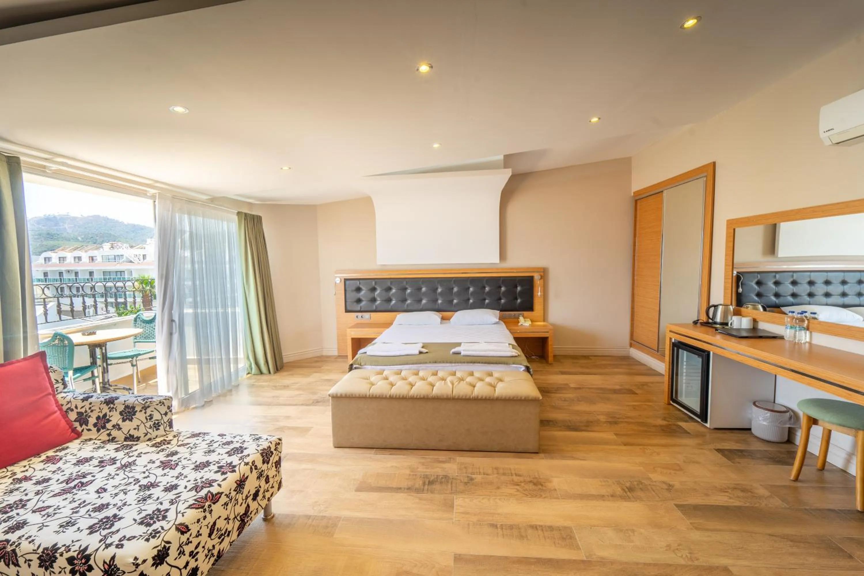 Bed in Aurasia Sea Side Hotel