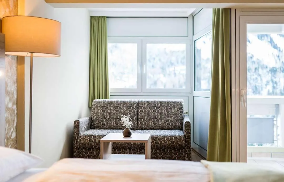 Seating area, Bed in Panorama Hotel Turracher Höhe
