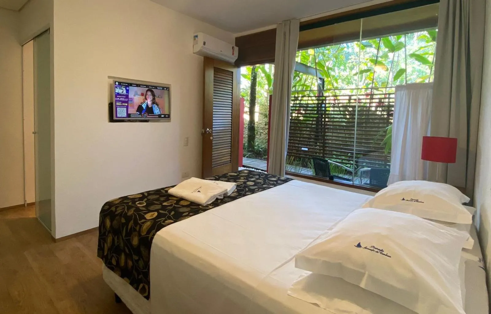 Bed in Pousada Armação de Camburi