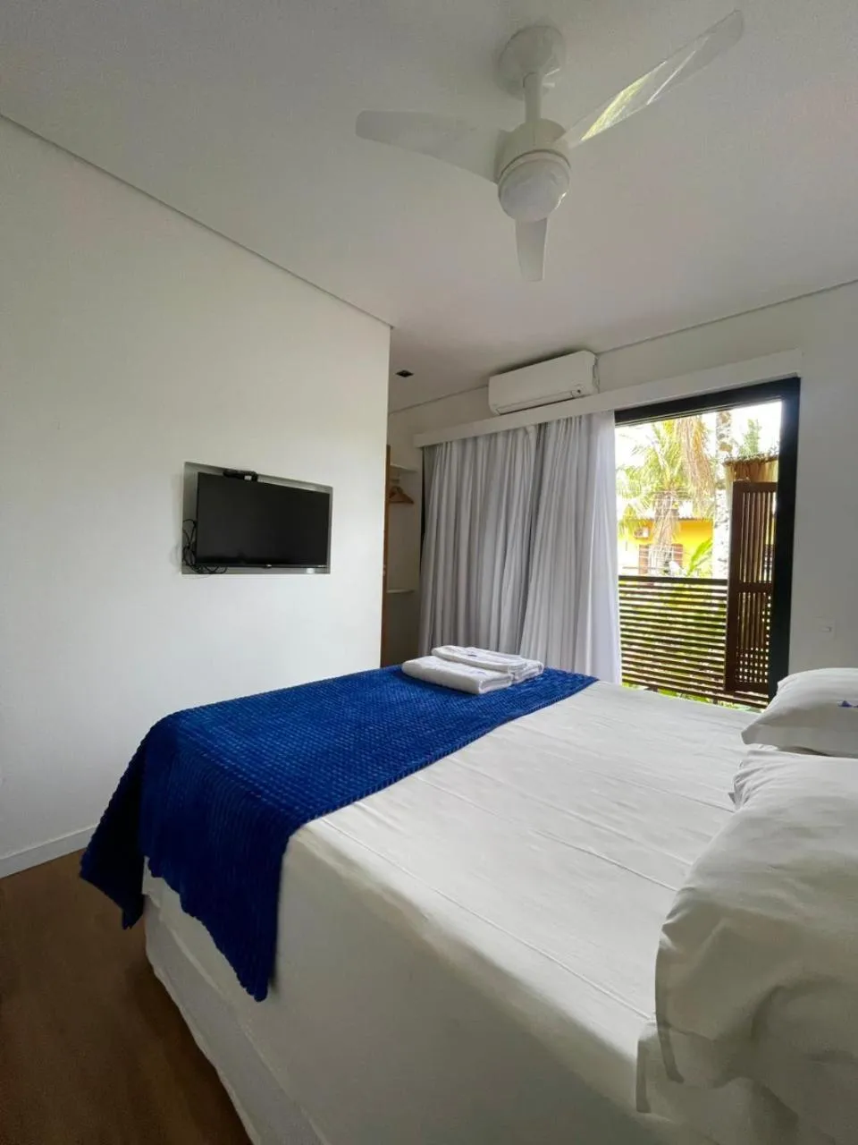 Bed in Pousada Armação de Camburi
