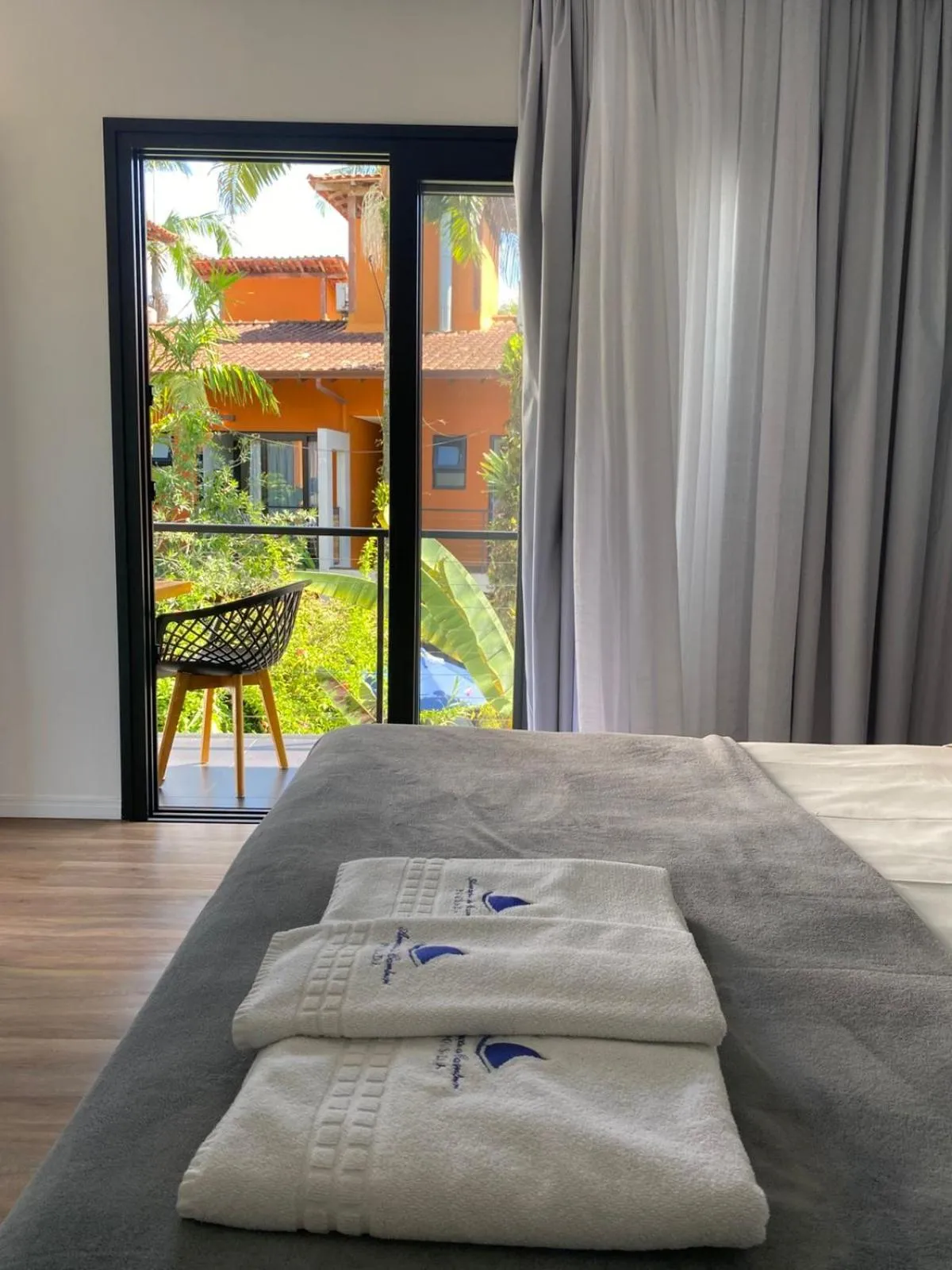 Bed in Pousada Armação de Camburi