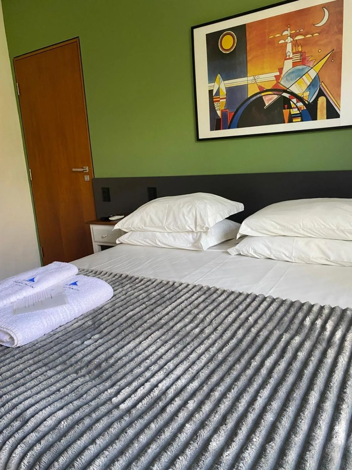 Bed in Pousada Armação de Camburi