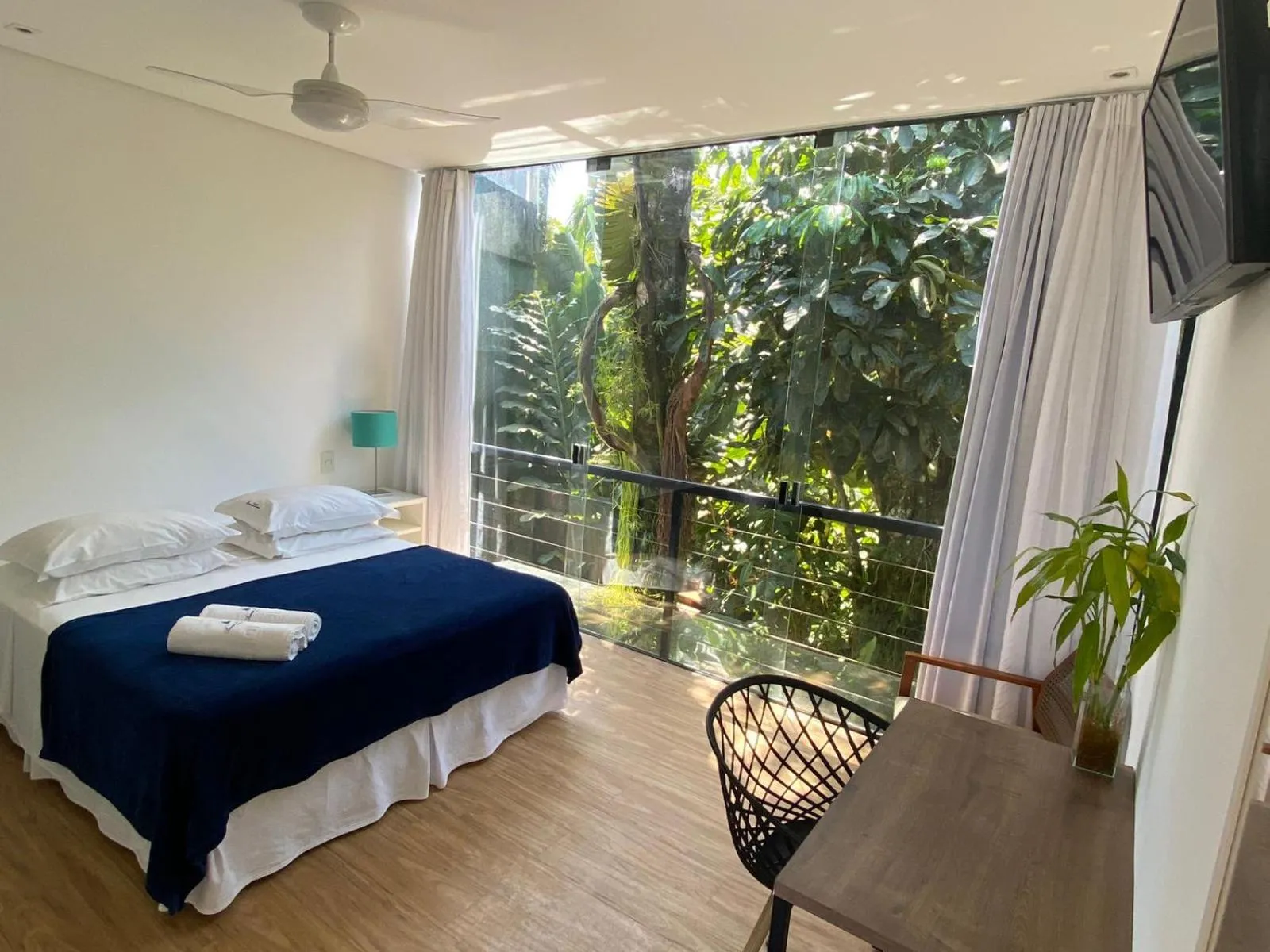 Bed in Pousada Armação de Camburi
