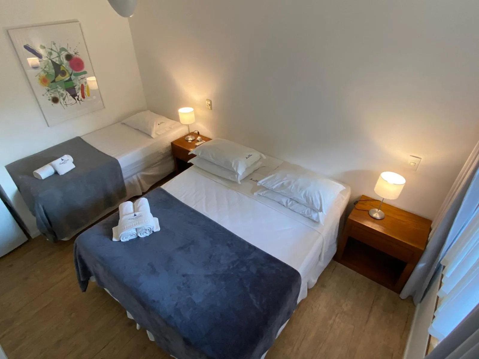 Bed in Pousada Armação de Camburi