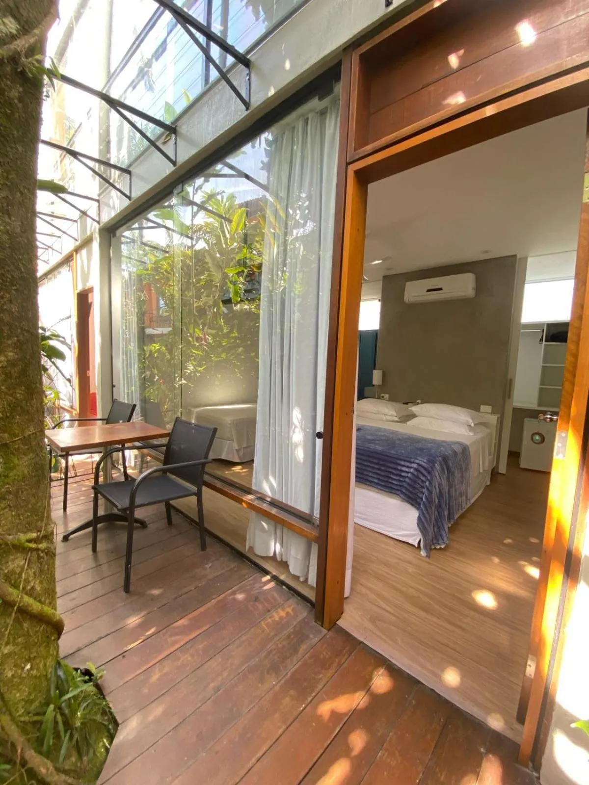 Bed in Pousada Armação de Camburi