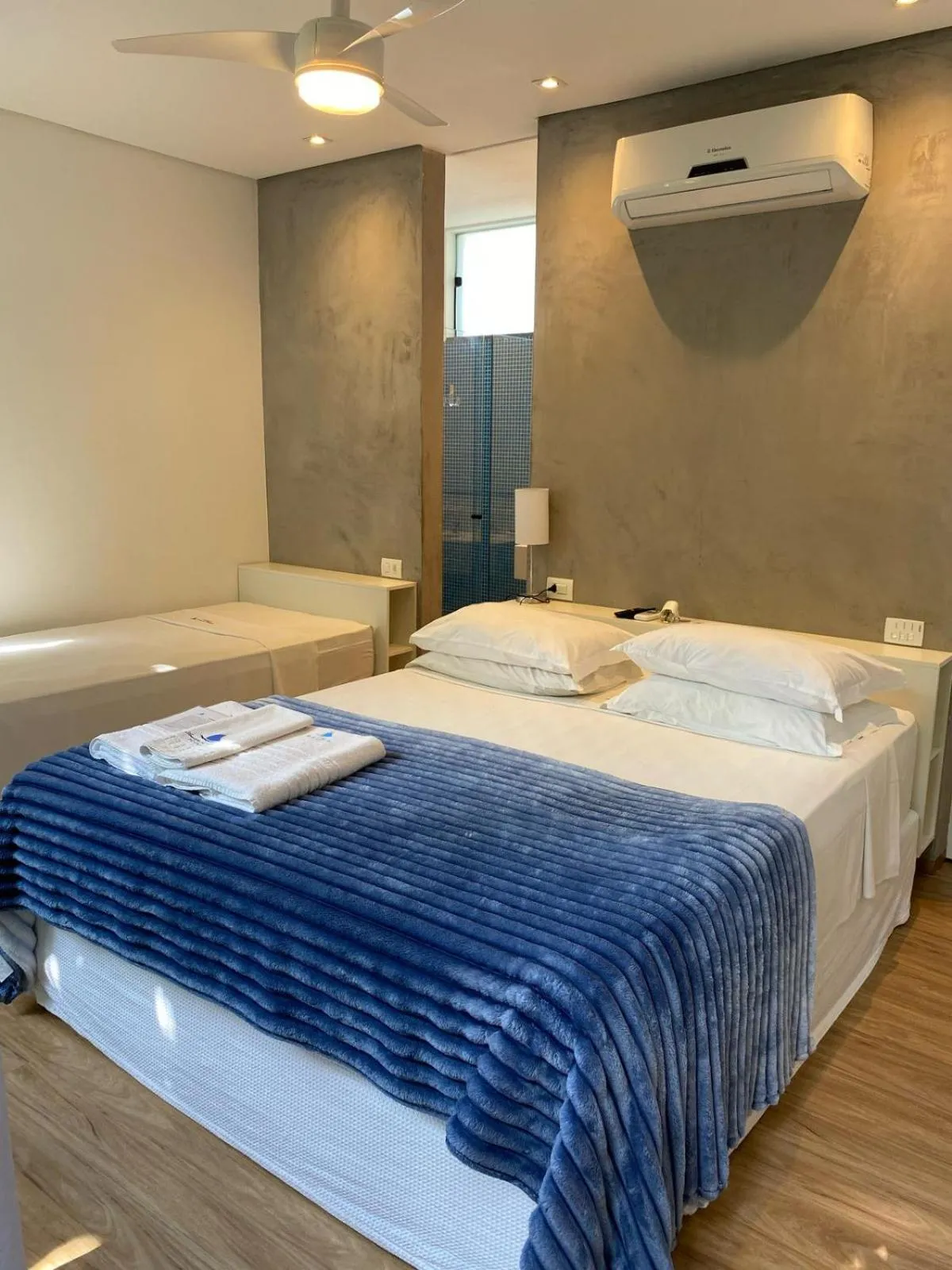 Bed in Pousada Armação de Camburi