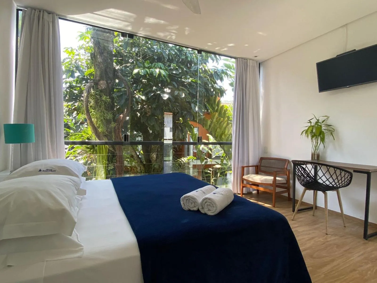 Bed in Pousada Armação de Camburi