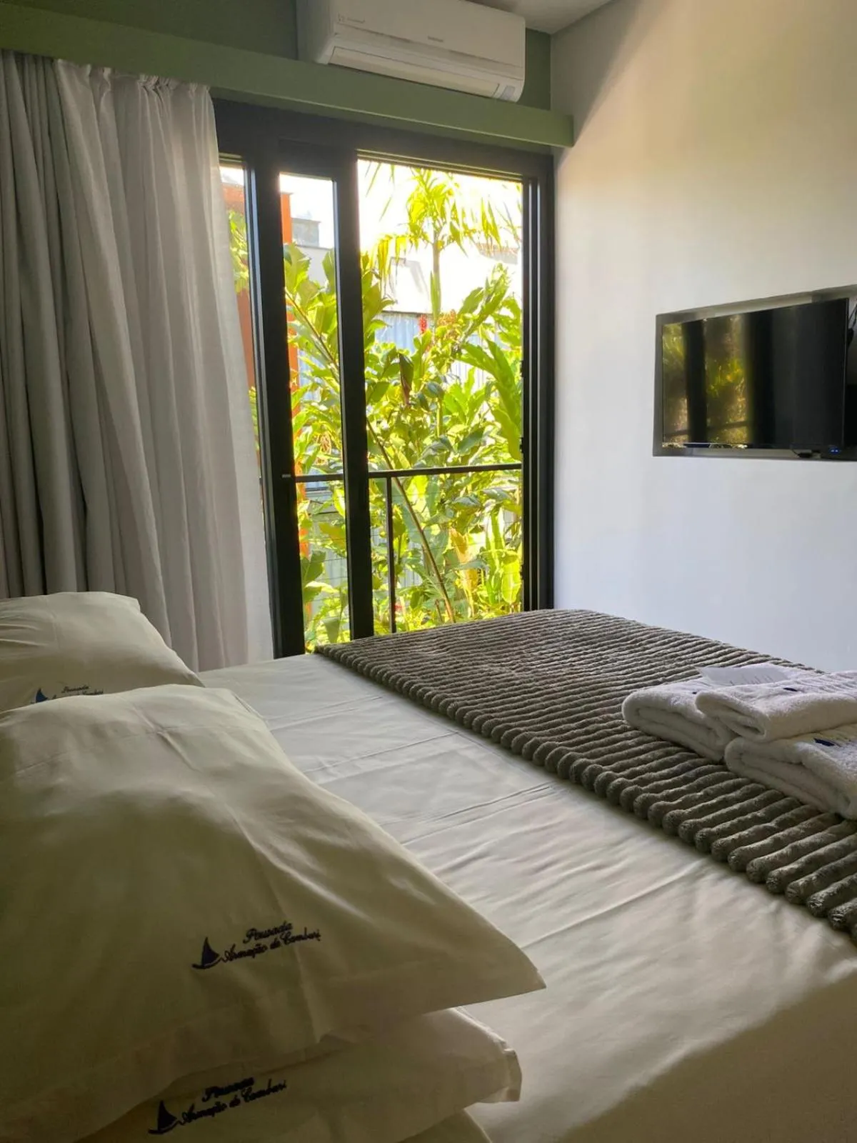 Bed in Pousada Armação de Camburi