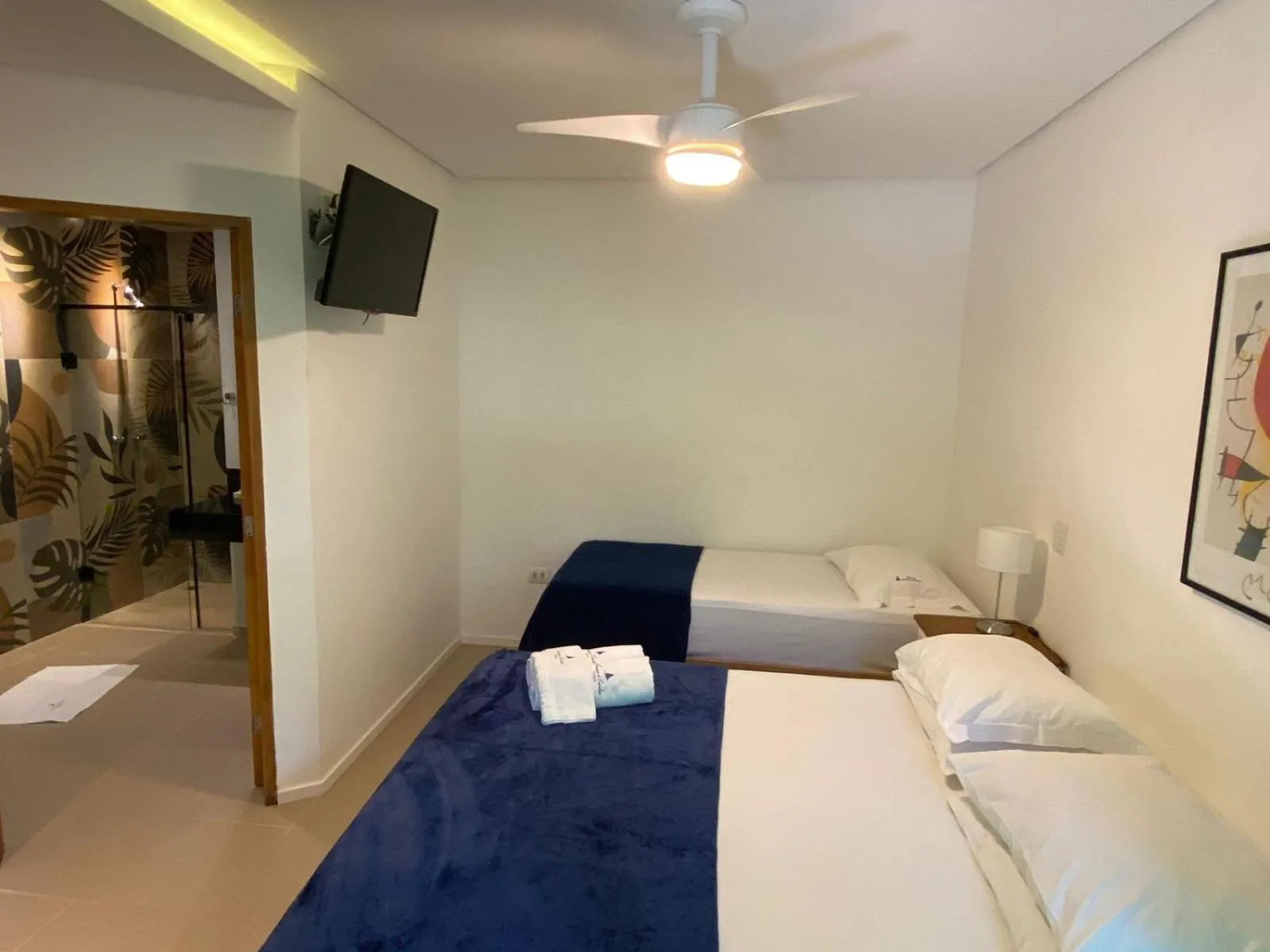 Bed in Pousada Armação de Camburi