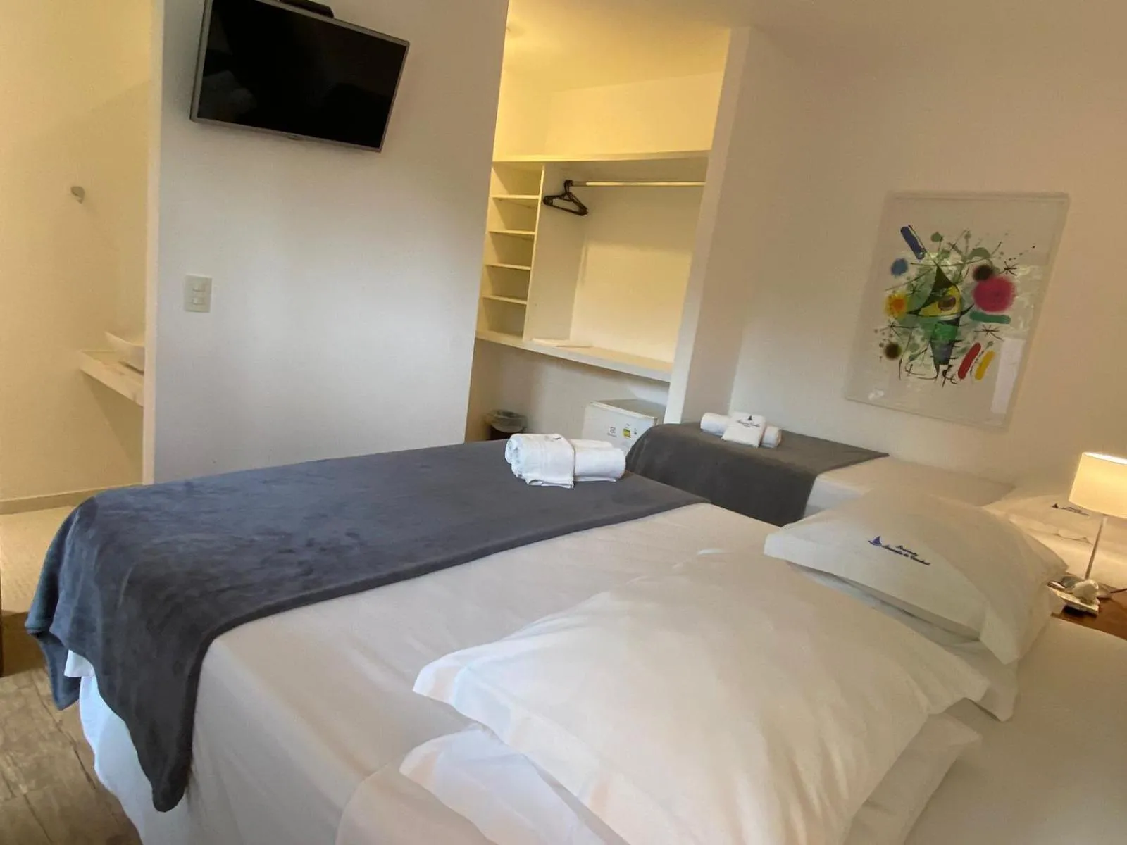 Bed in Pousada Armação de Camburi