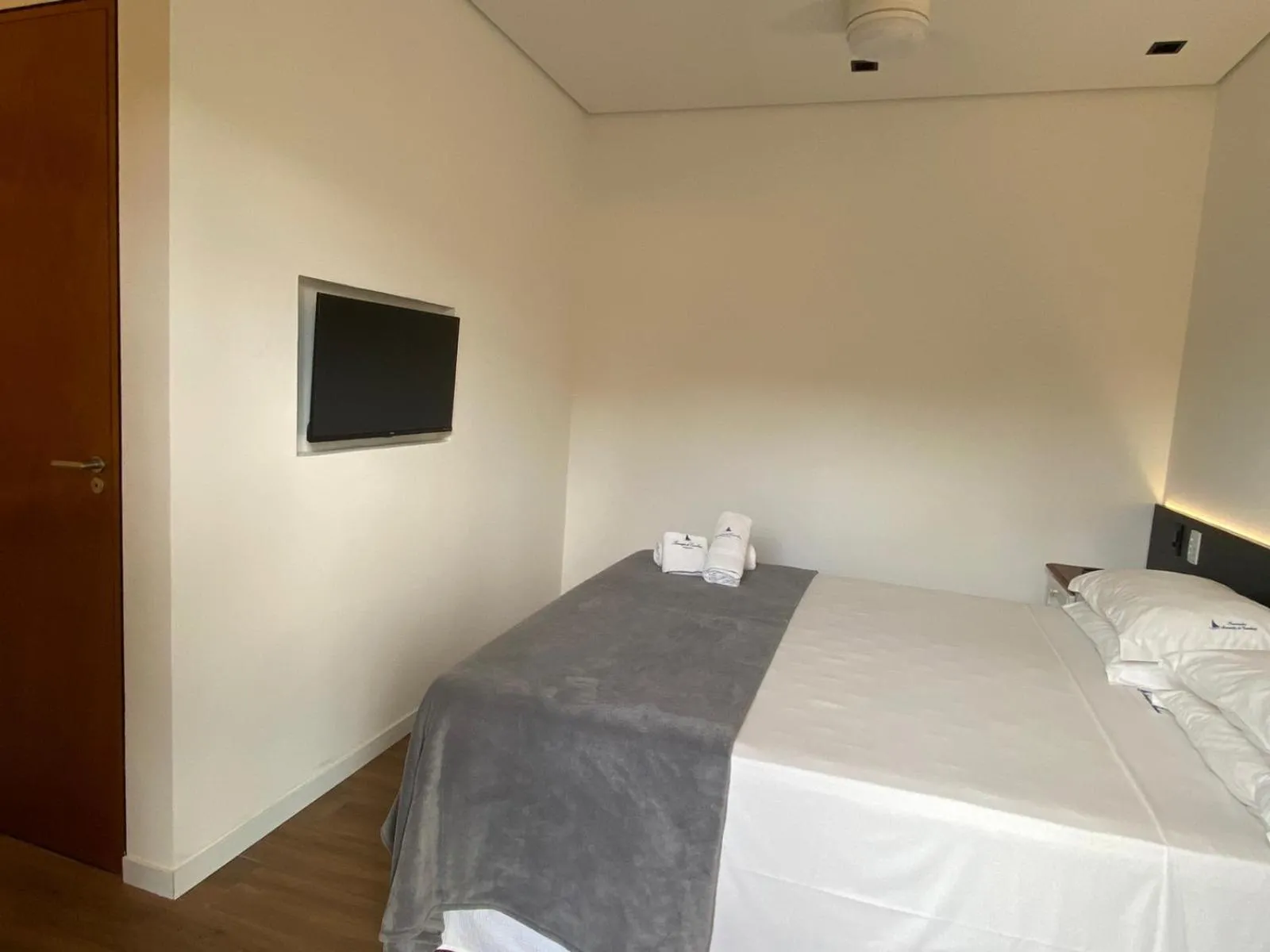 Bed in Pousada Armação de Camburi