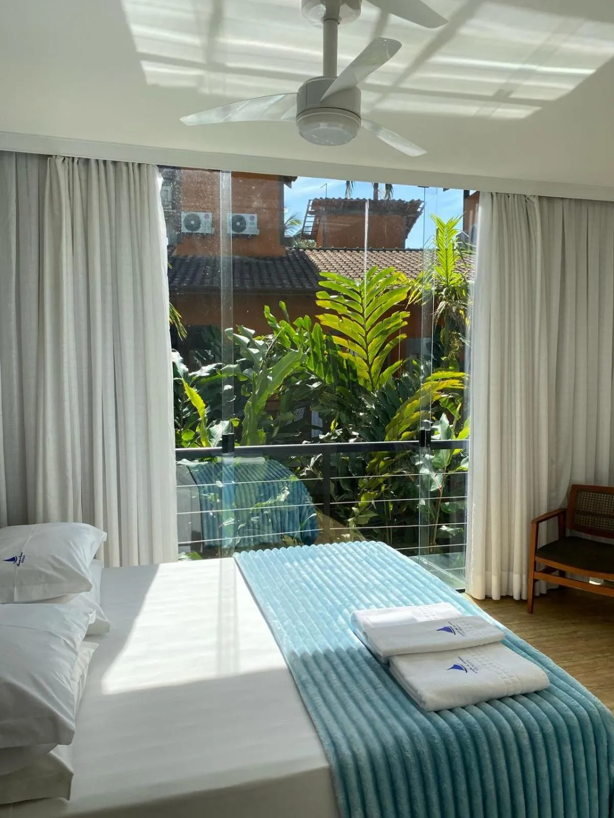 Bed in Pousada Armação de Camburi