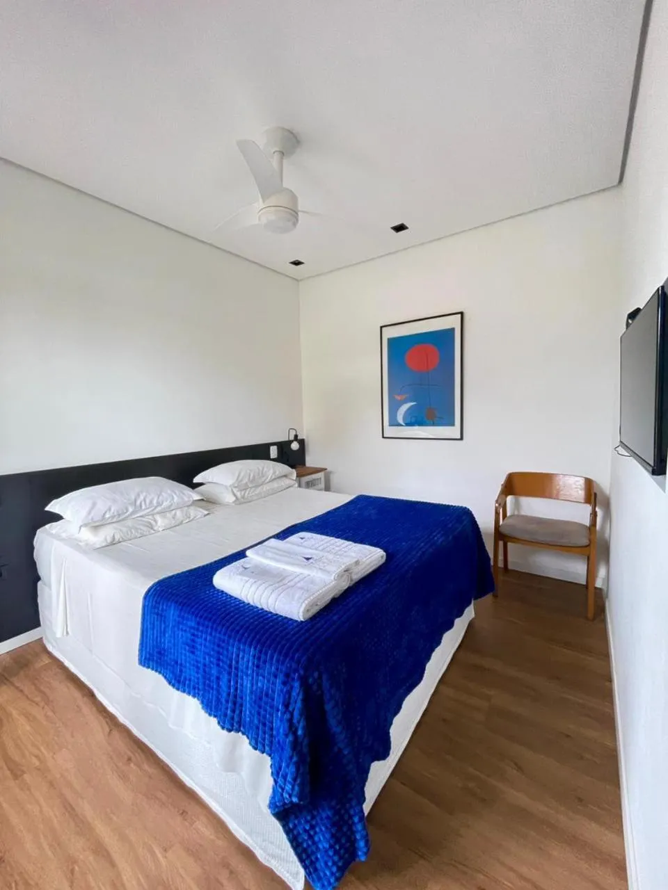 Bed in Pousada Armação de Camburi