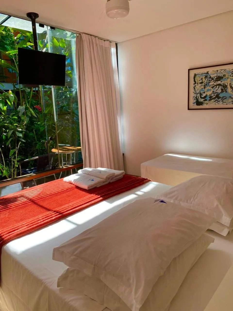 Bed in Pousada Armação de Camburi