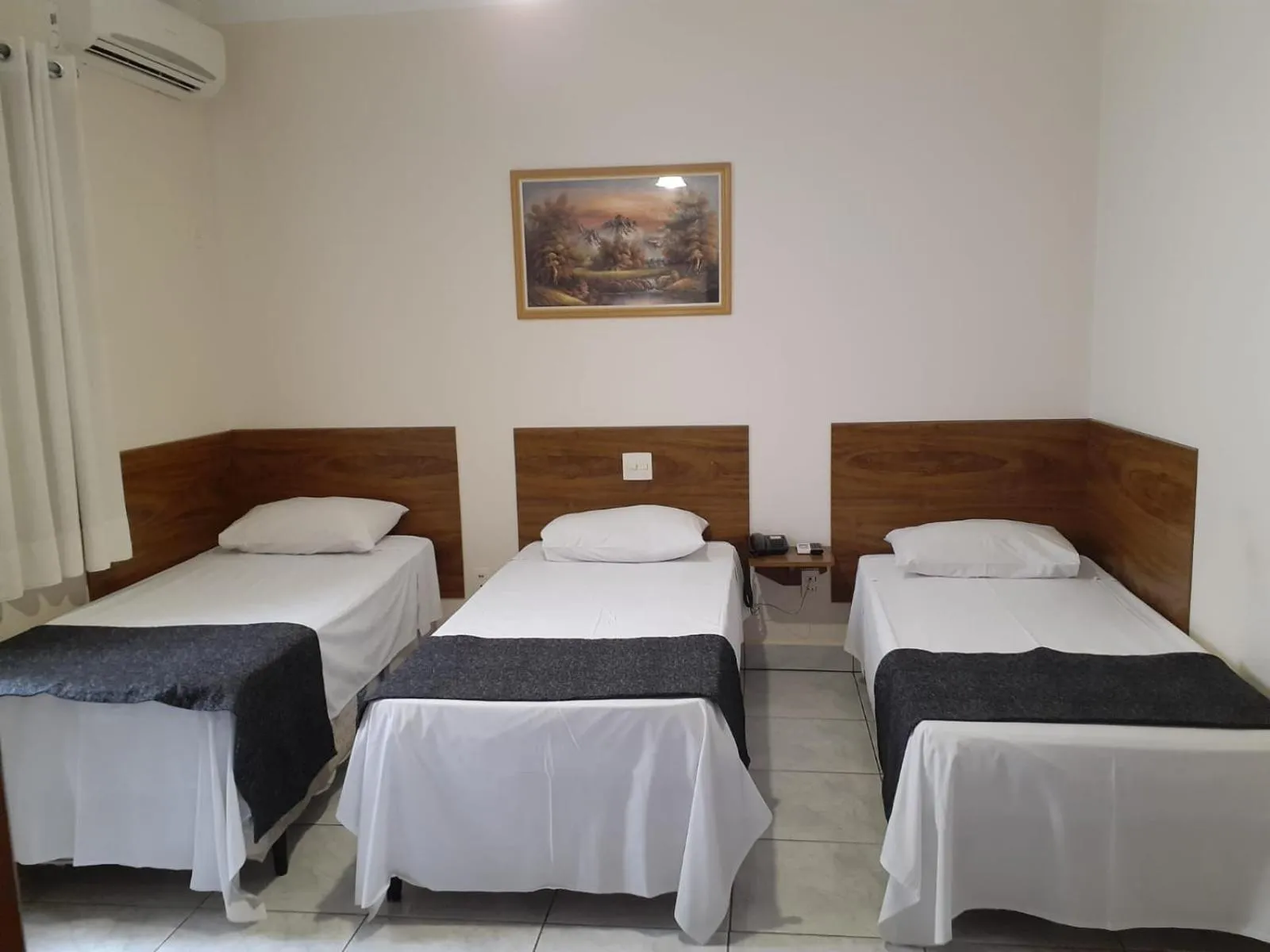 Bed in Rio Claro Plaza Hotel