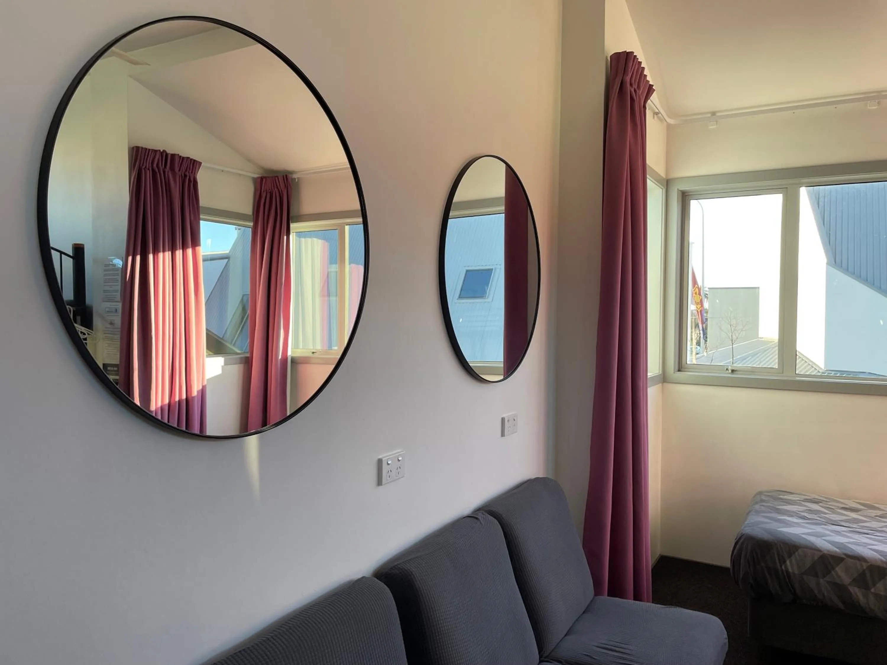 Seating area, Bed in YHA Nelson