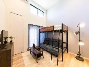 Bed in TRIP POD MINOSHIMA A