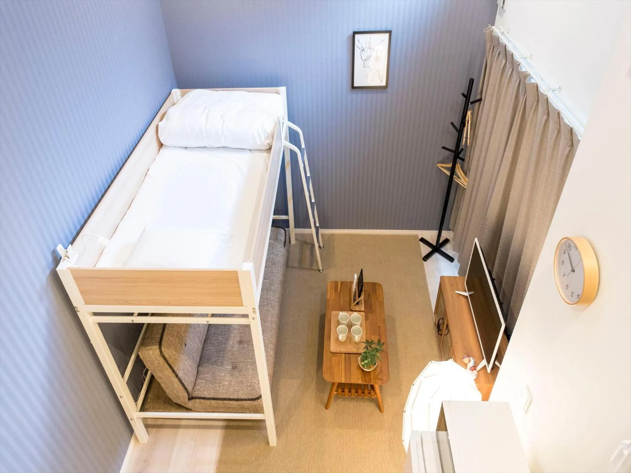 Living room, Bed in TRIP POD SUMIYOSHI B