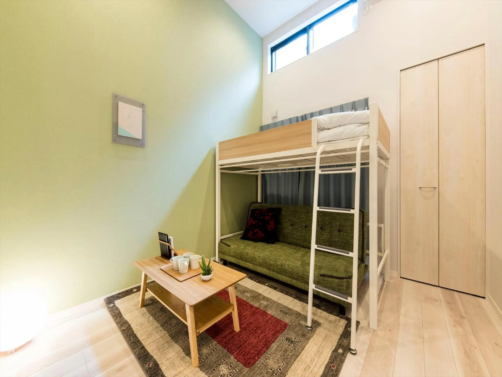 Living room, Bed in TRIP POD SUMIYOSHI B