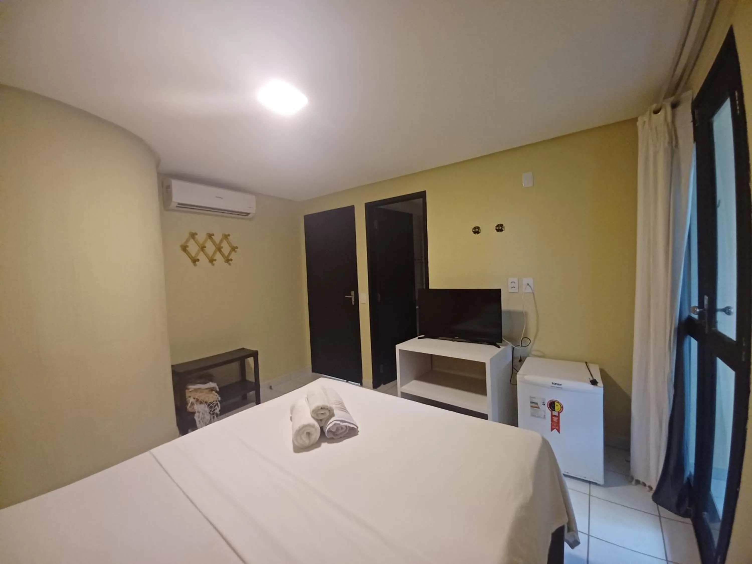 Bed in Pousada Laguna