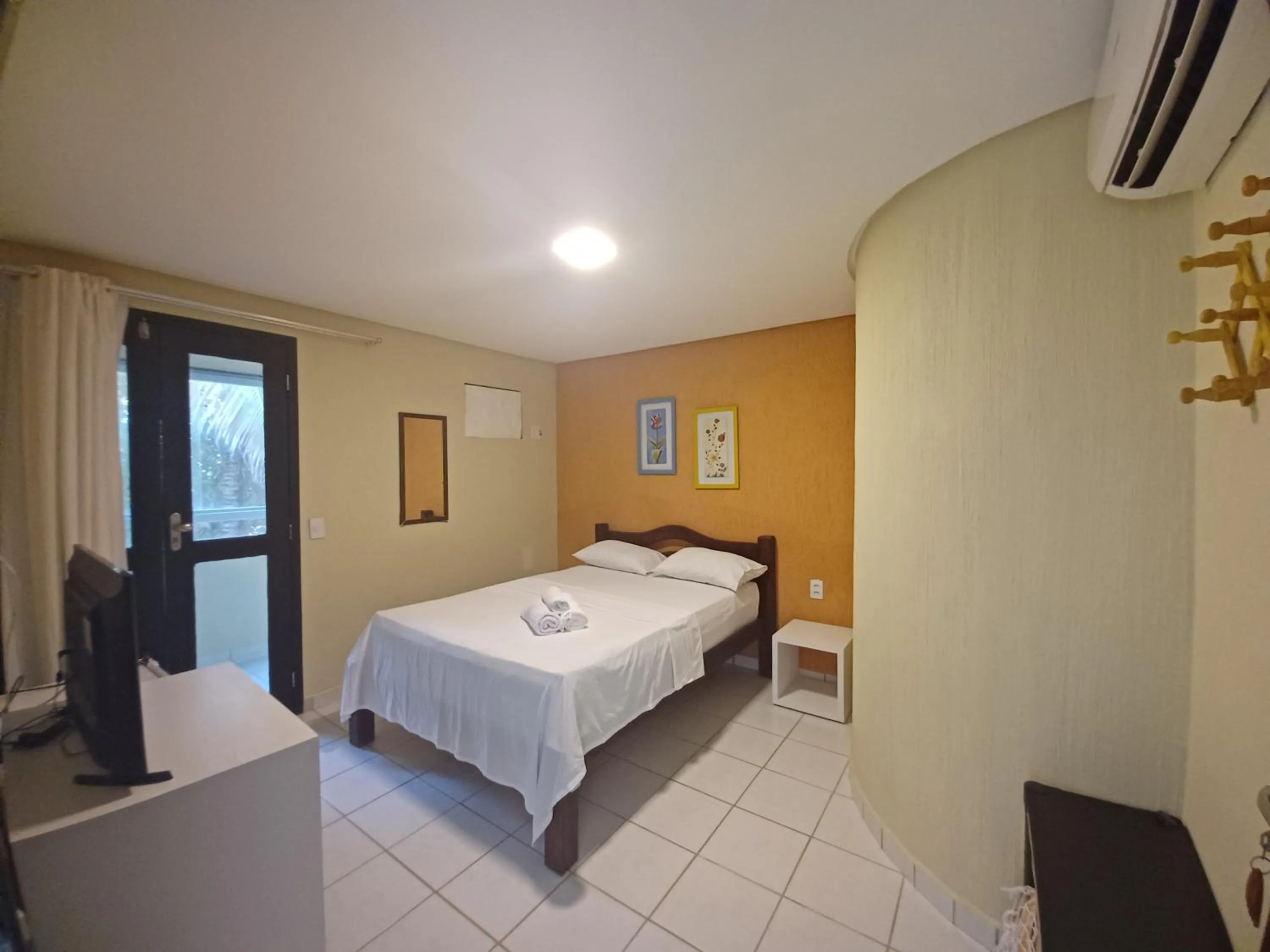 Bed in Pousada Laguna