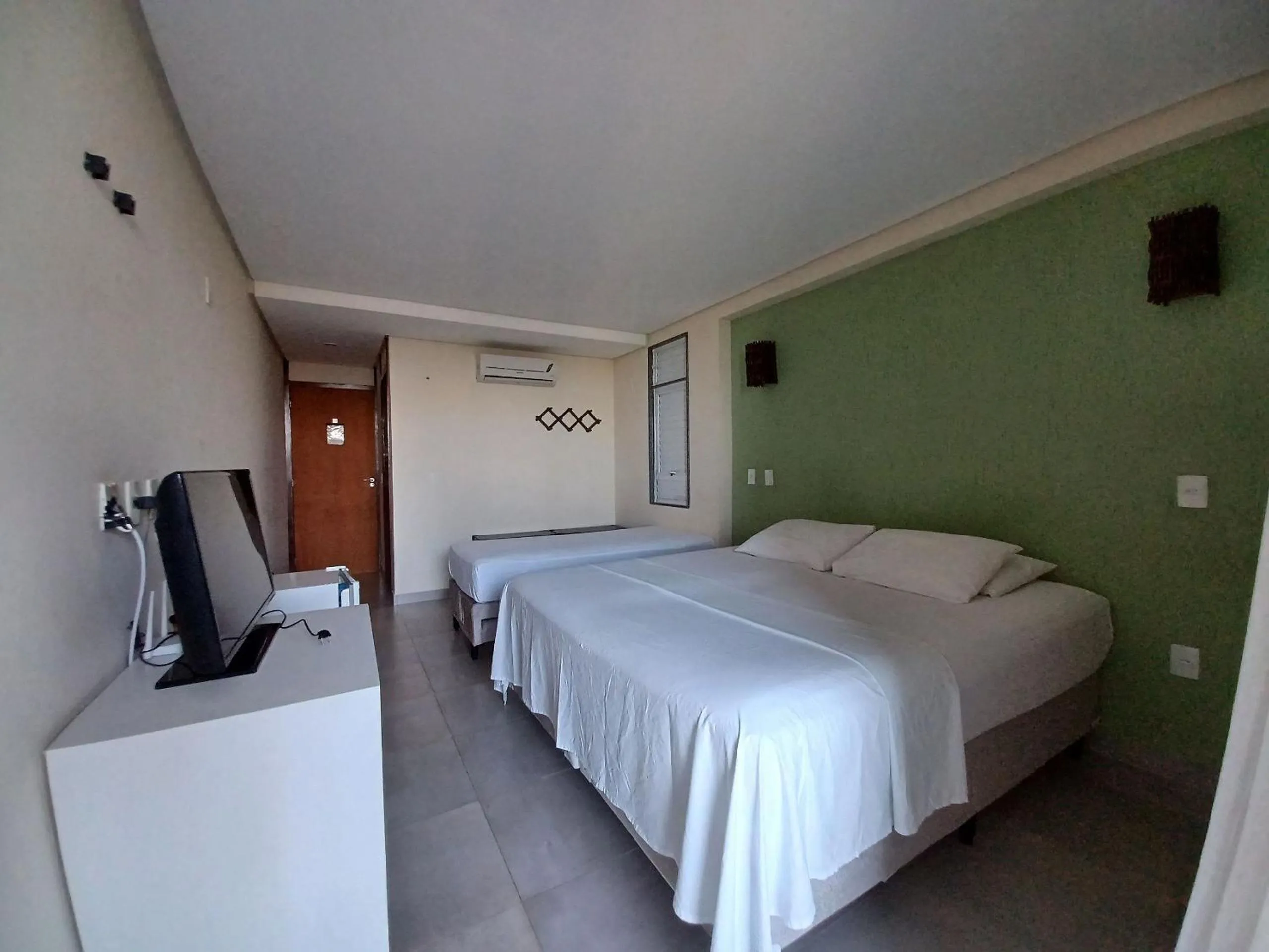 Bed in Pousada Laguna