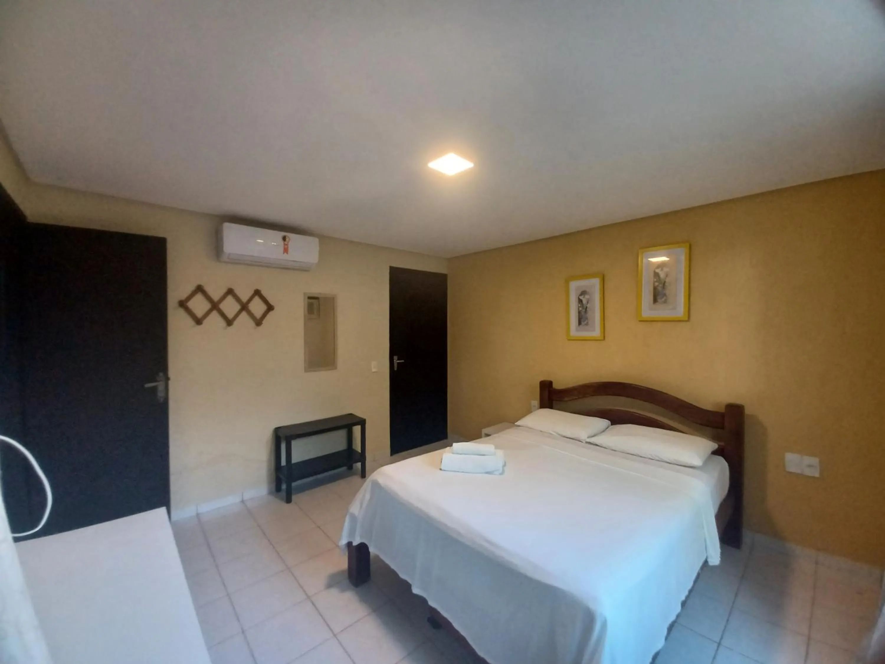 Bed in Pousada Laguna