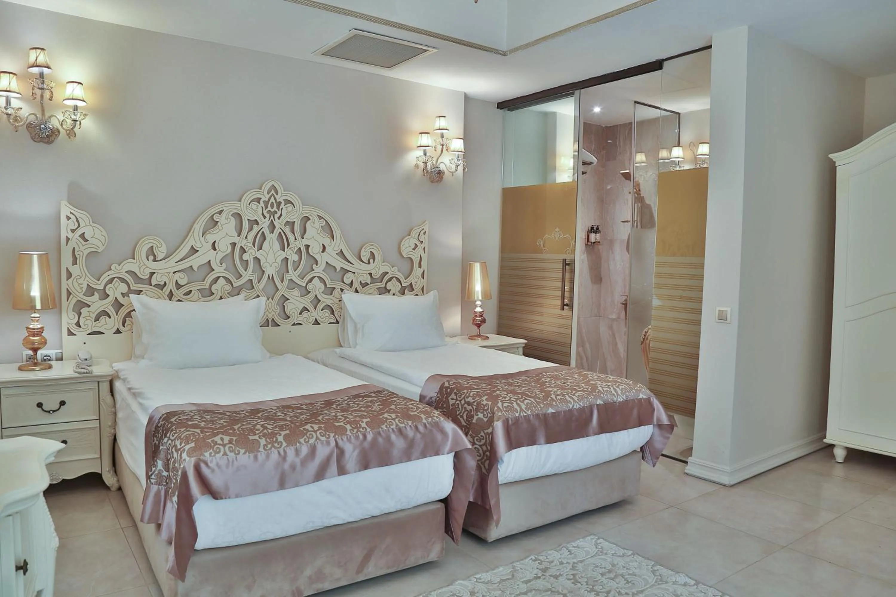 Bed in Elegance East Hotel