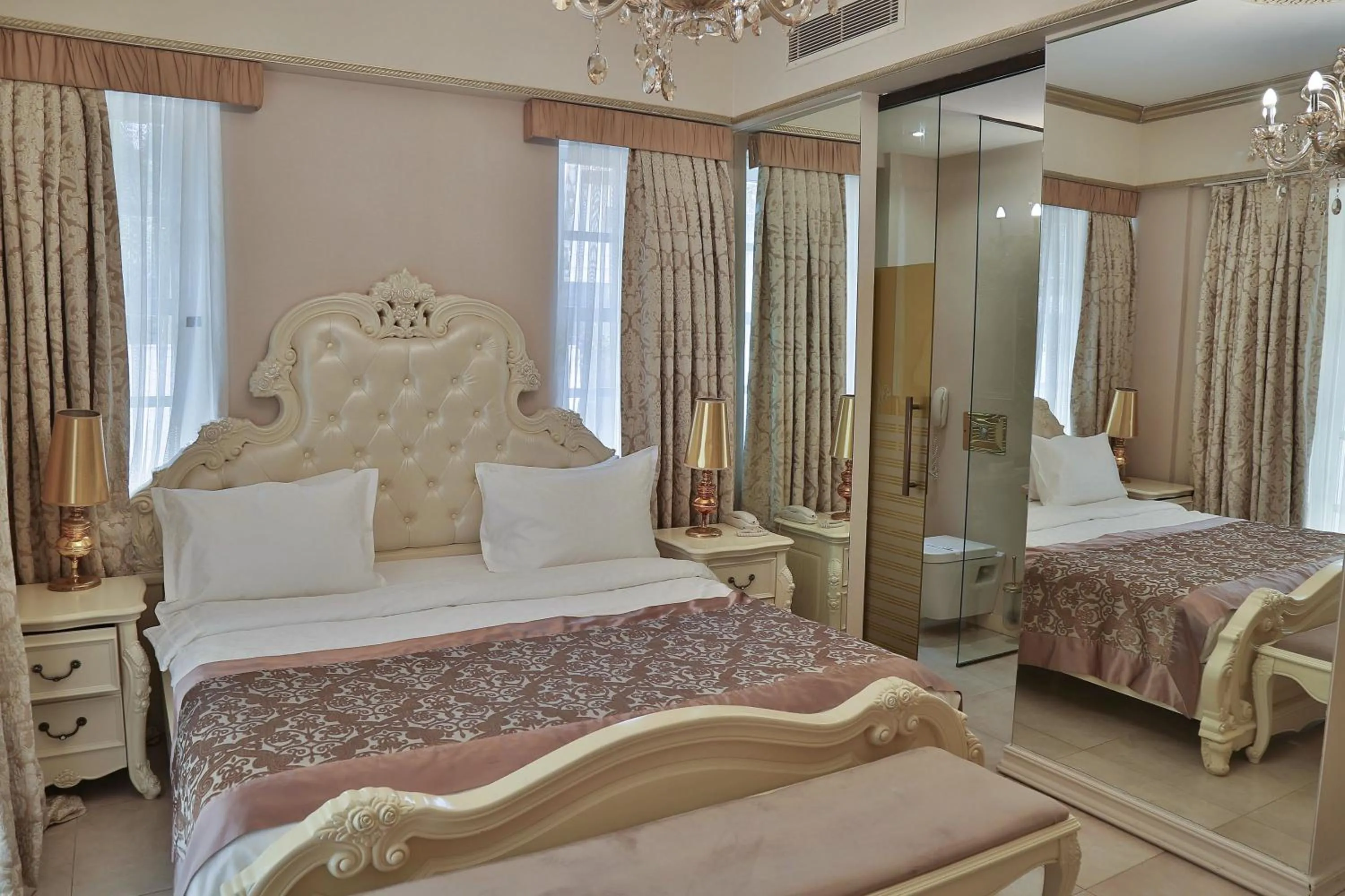 Bed in Elegance East Hotel