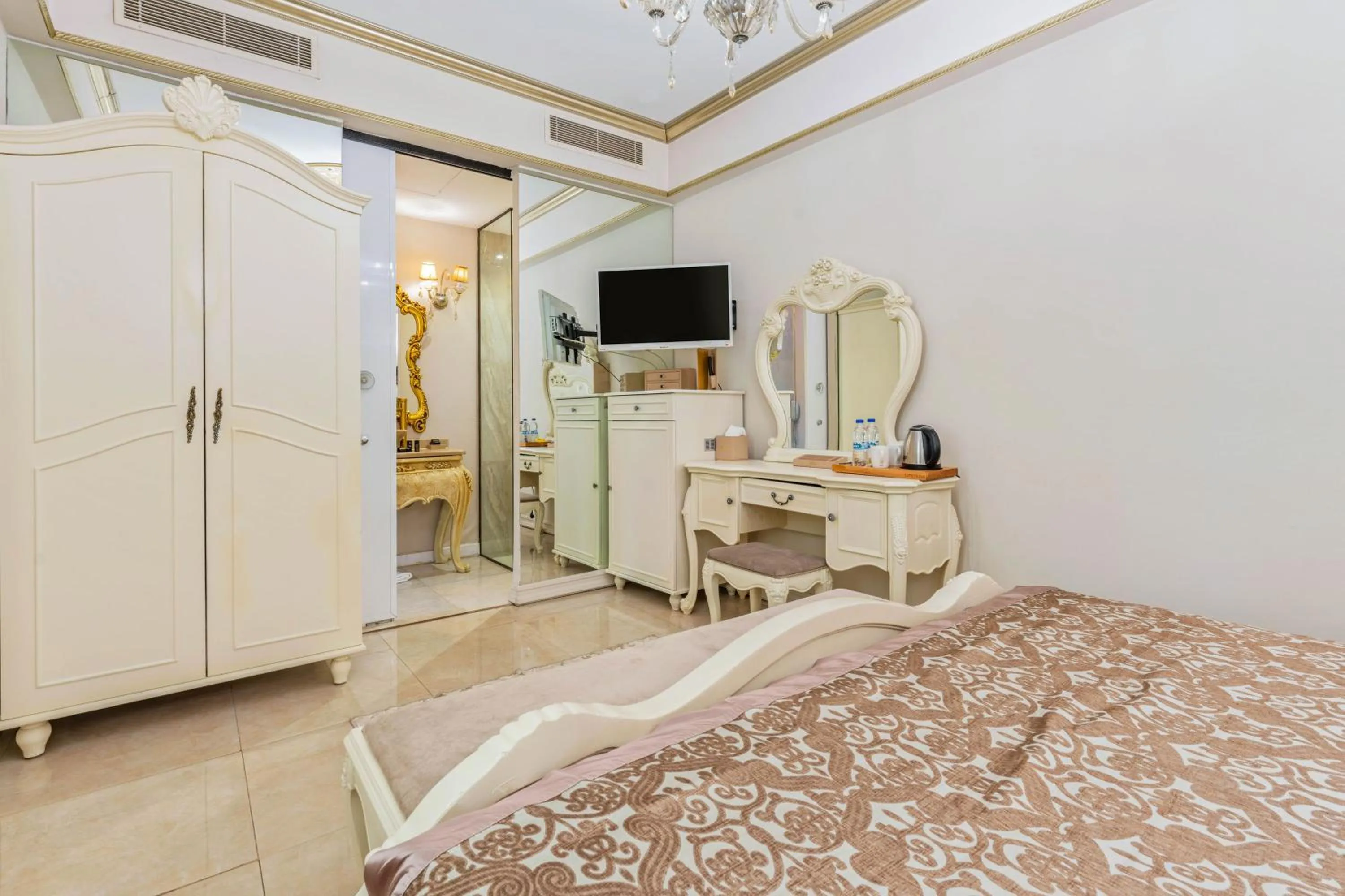 Bed in Elegance East Hotel