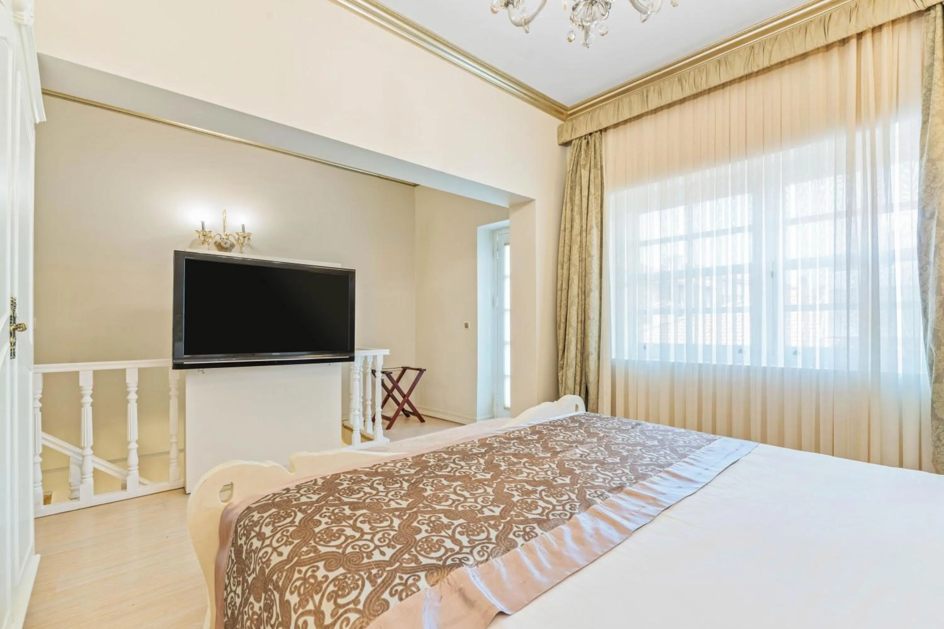 Bed in Elegance East Hotel