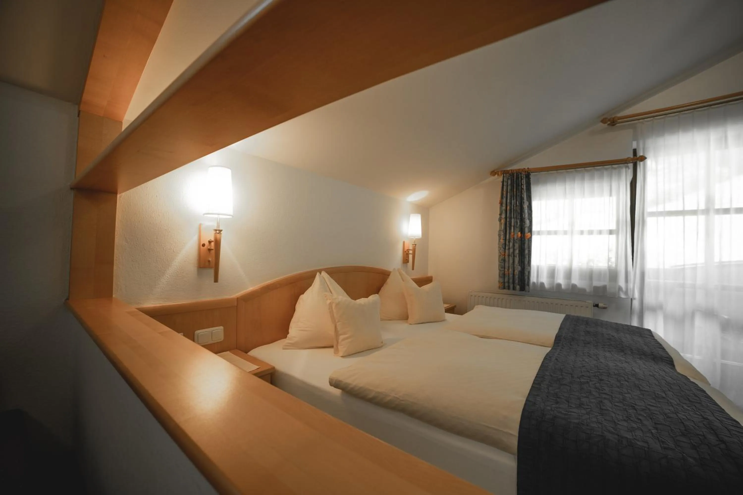 Bed in Hotel Landhaus Neumayr