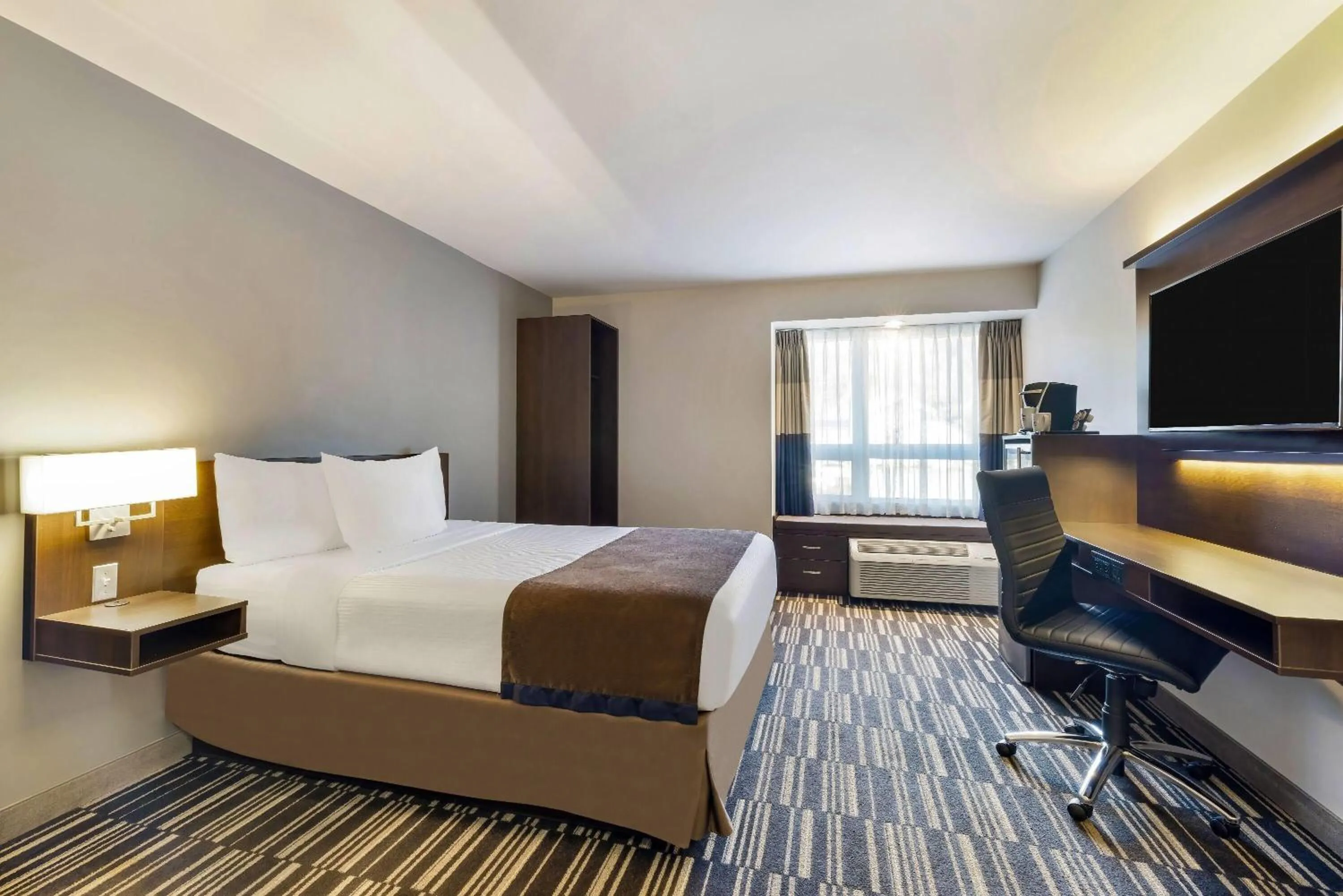 Bed in Microtel Inn & Suites by Wyndham Mont Tremblant