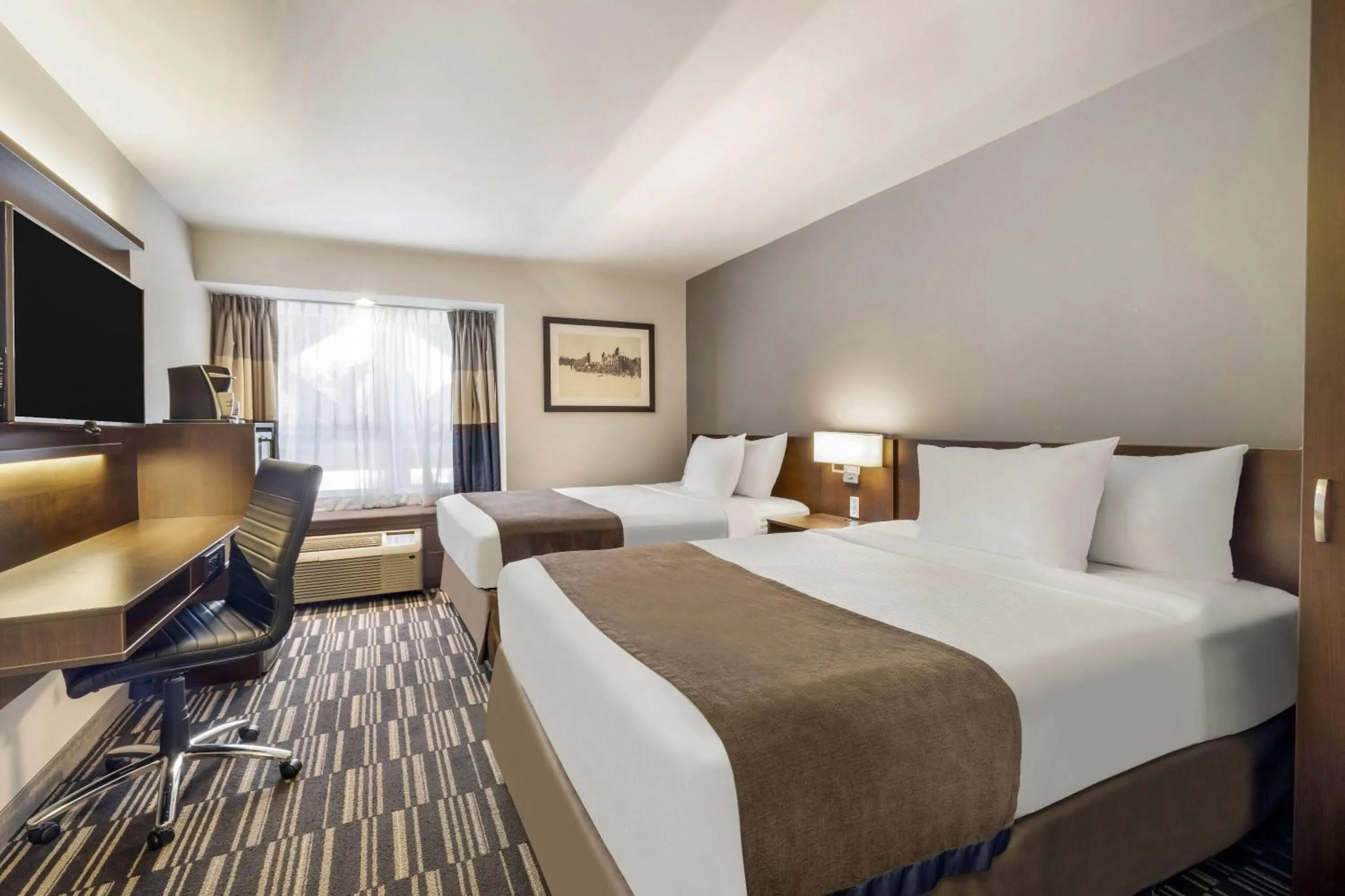 Bed in Microtel Inn & Suites by Wyndham Mont Tremblant