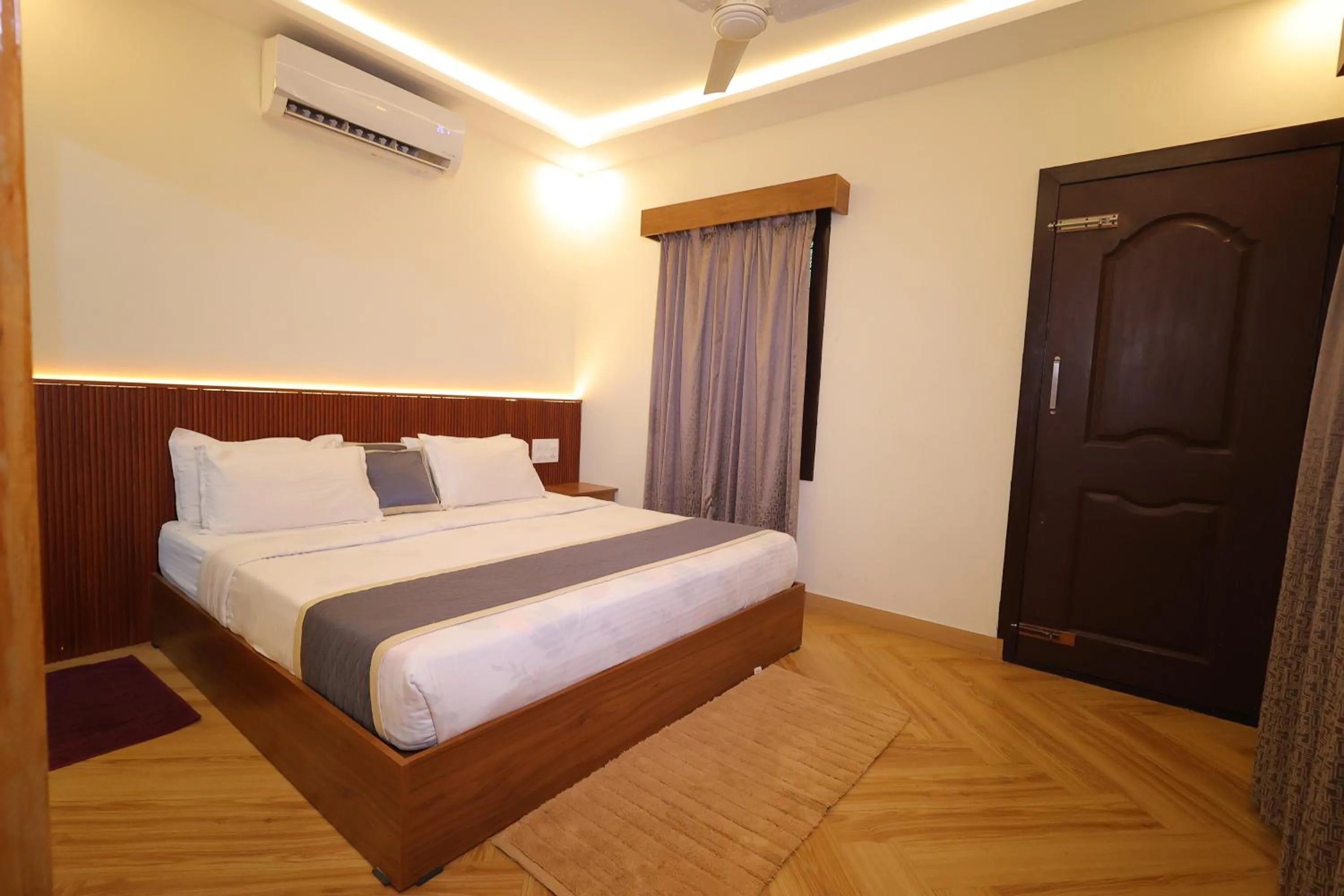 Bed in Le Eden Premium Wayanad Pool Resort