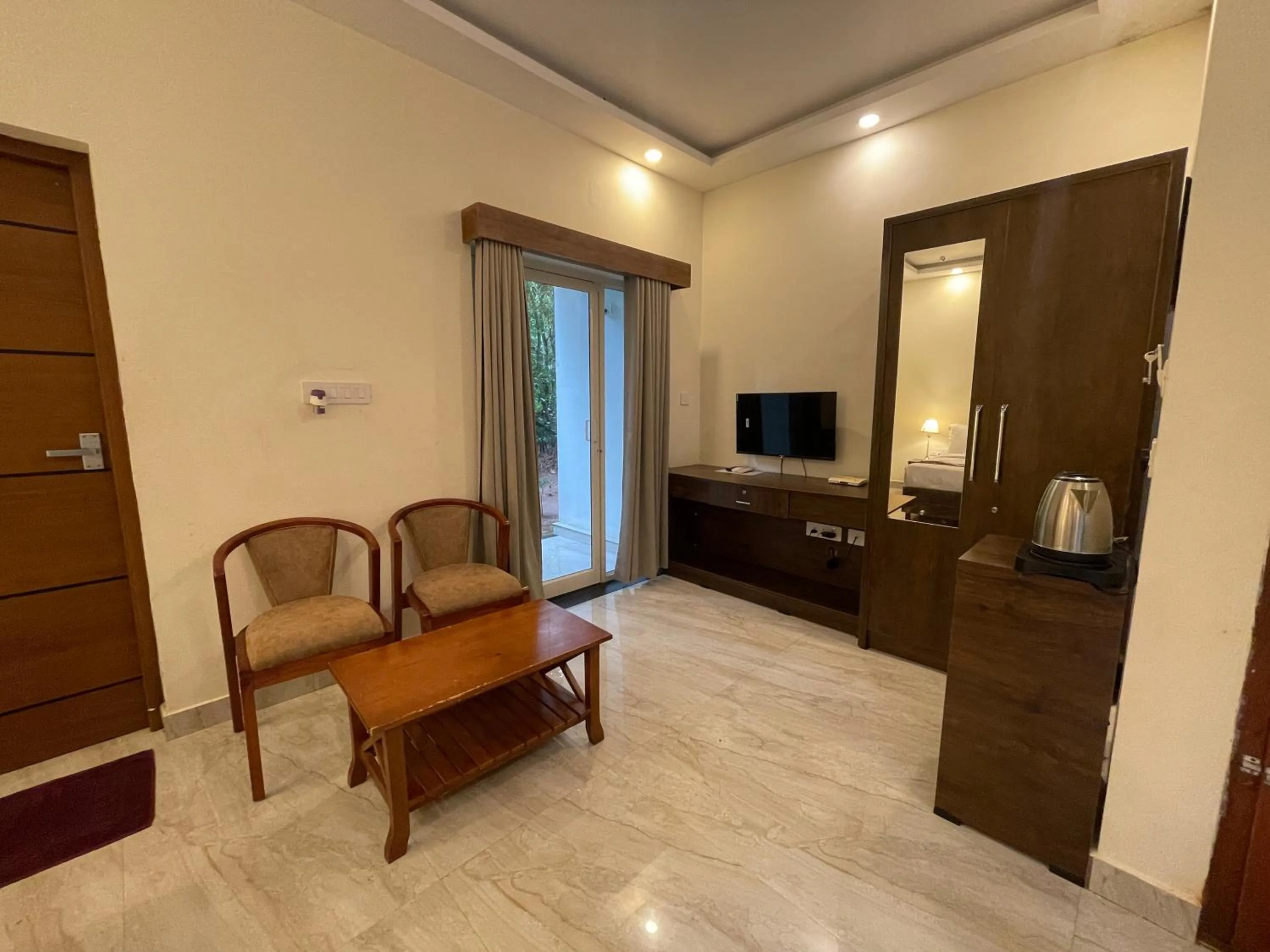 TV and multimedia in Le Eden Premium Wayanad Pool Resort