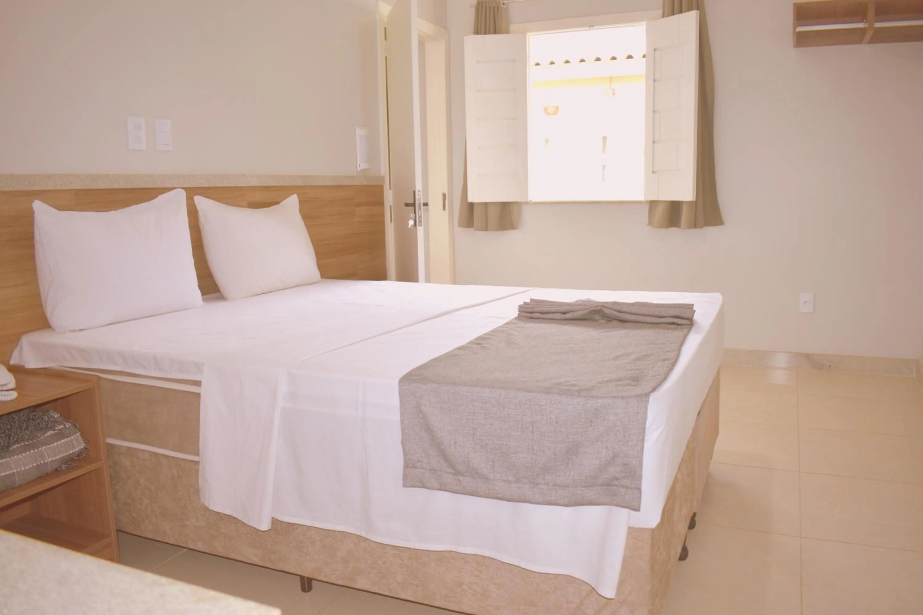 Bed in Tropical Mar Hotel