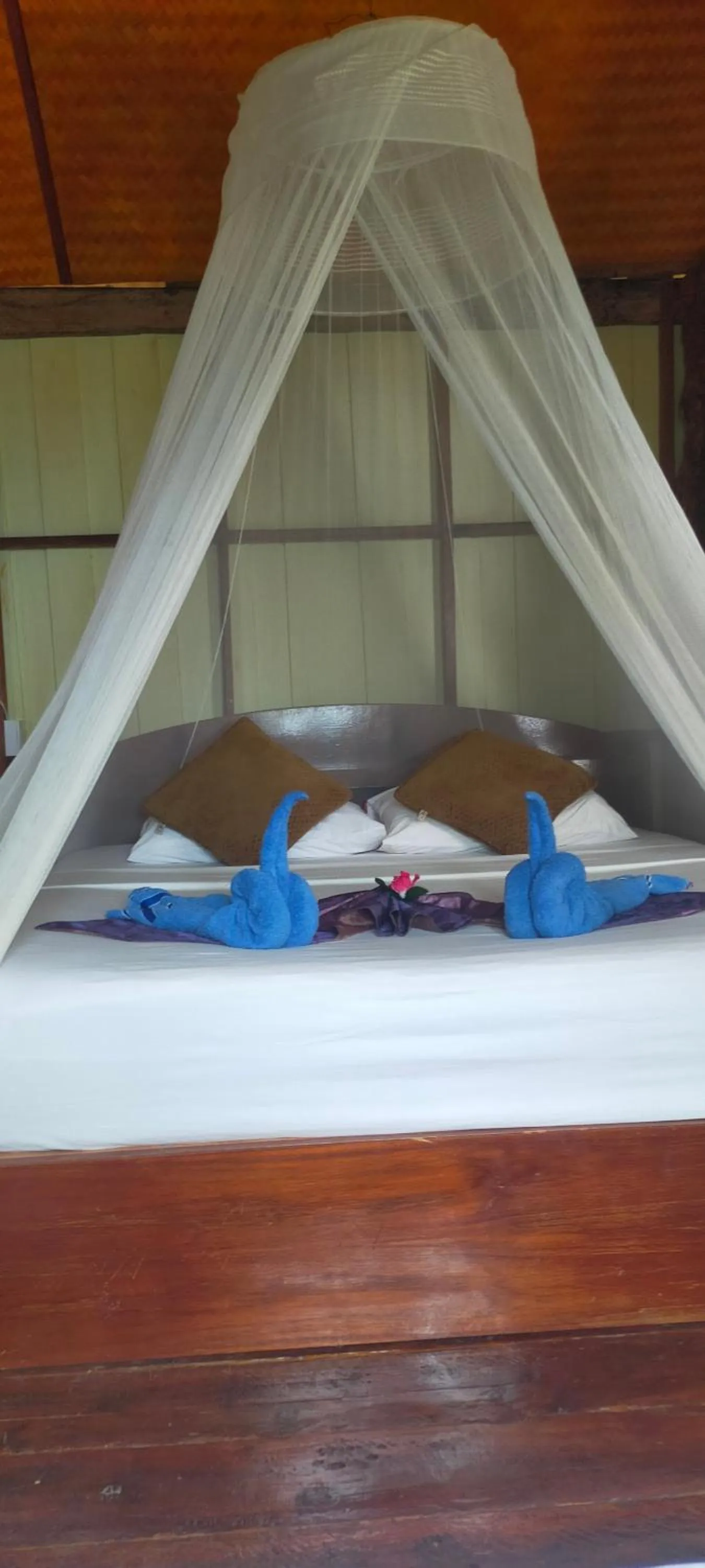 Bed in Jungle Hill Beach Bungalow
